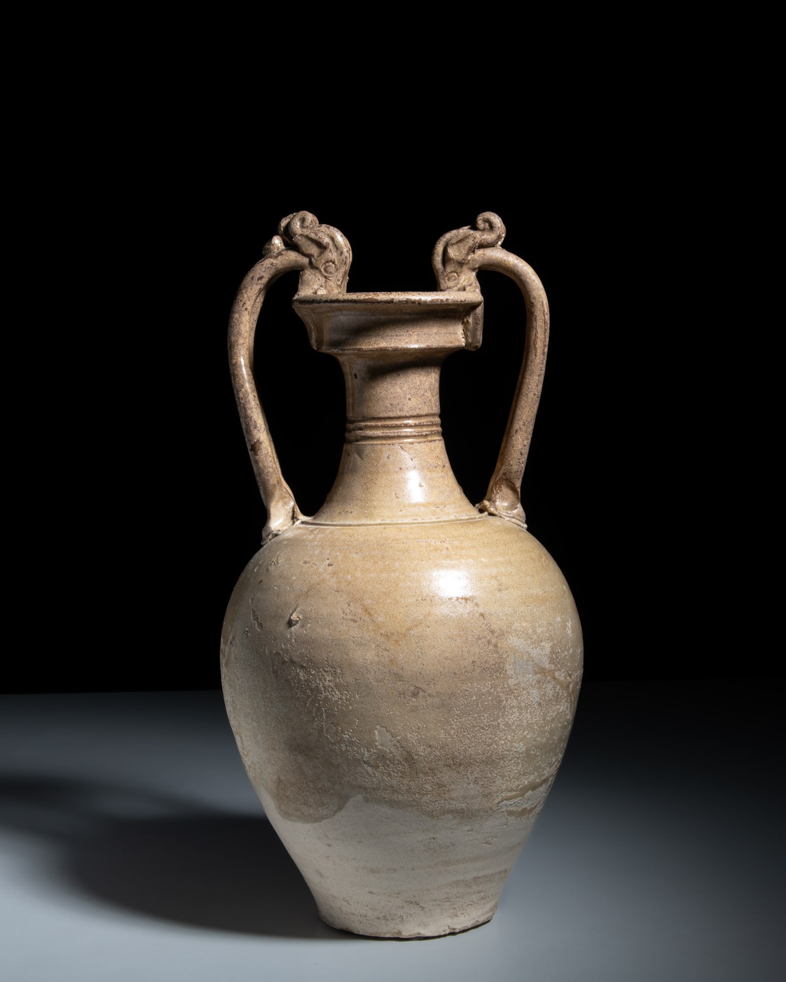 A RARE WHITE-GLAZED 'DRAGON-HANDLE' AMPHORA 唐 邢窑白釉双 (1 of 5)