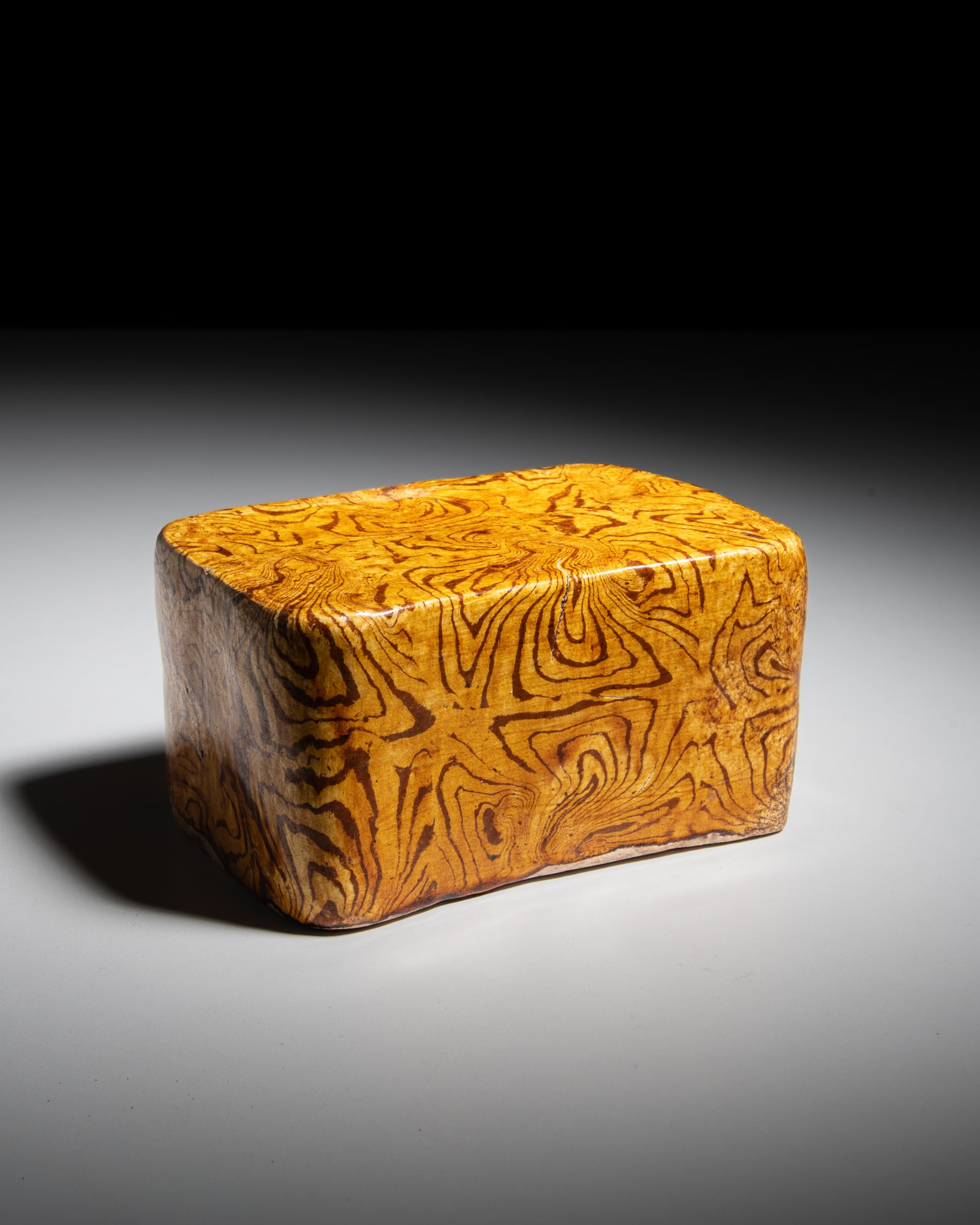 A SMALL AMBER-GLAZED MARBLED PILLOW 唐代 黄釉绞胎枕 Chi (1 of 4)