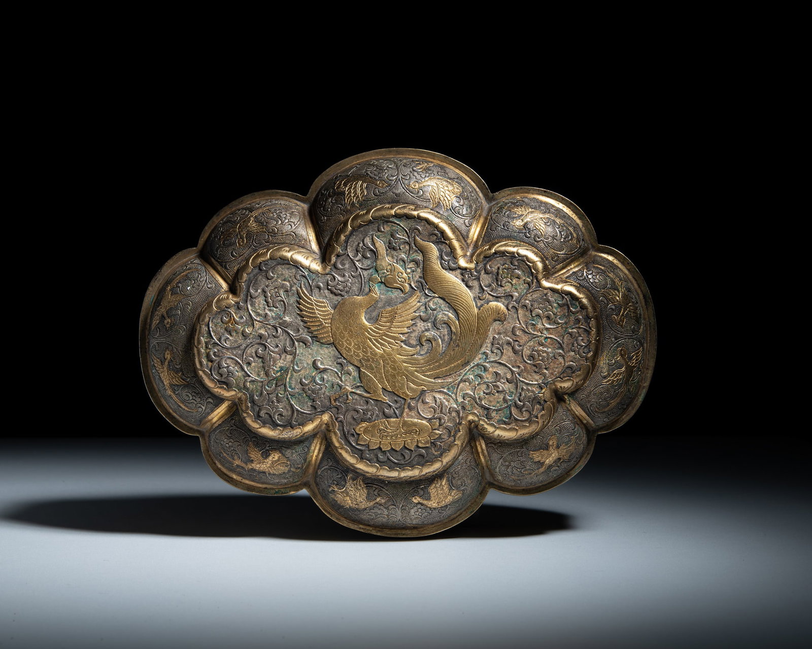 A LARGE LOBED PARTLY GILT 'PHOENIX' SILVER BOX 辽代（或）银 (1 of 3)