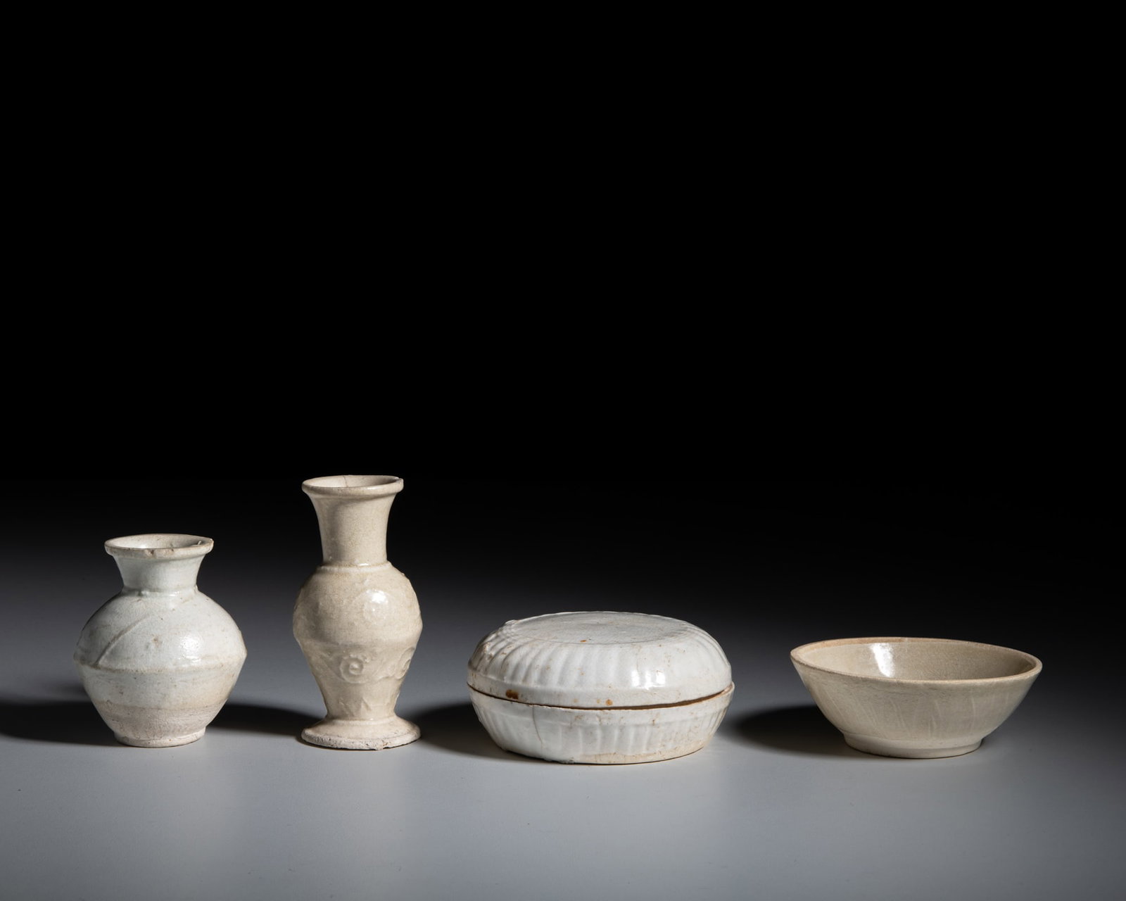 A COLLECTION OF FOUR DING WARE WHITE-GLAZE PIECES 宋代 定窑白瓷 (1 of 1)