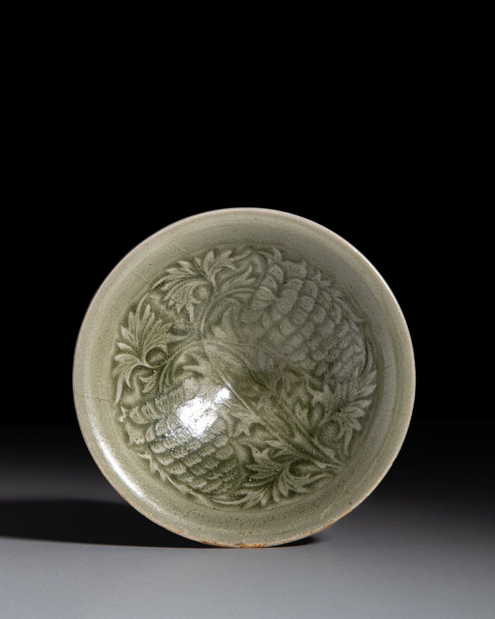 A RARE CARVED YAOZHOU CELADON BOWL WITH ‘PINEAPPLE’ MOTIF 宋代 耀: A RARE CARVED YAOZHOU CELADON BOWL WITH ‘PINEAPPLE’ MOTIF 宋代 耀州菠萝花纹斗笠盏 China, Song dynasty (960-1279) D.14.4cm 