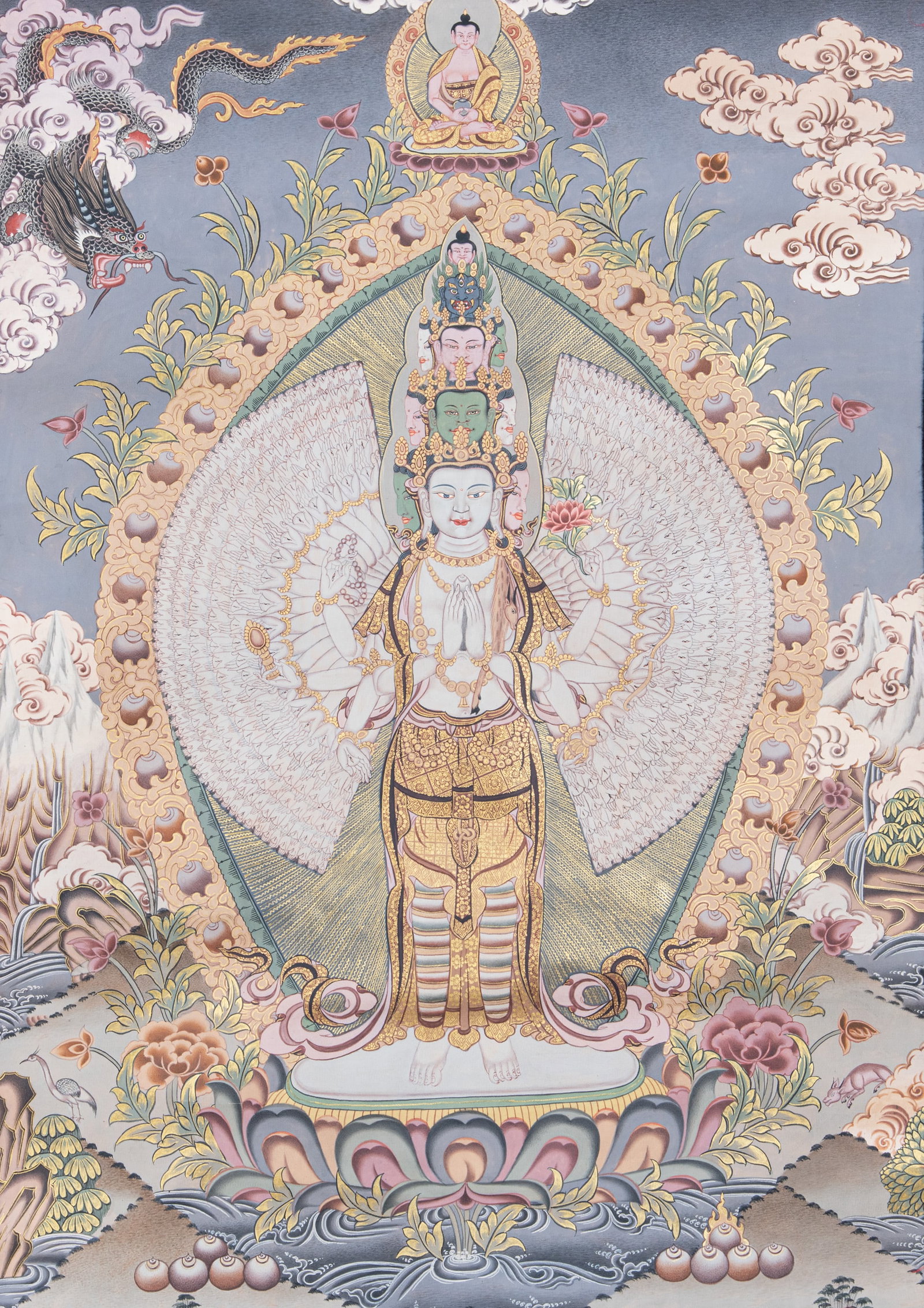 A LARGE POLYCHROME AND GILT THANGKA ON CLOTH DEPICTING ARYA-AVALOKITESHVARA Nepal, late 20th (1 of 2)