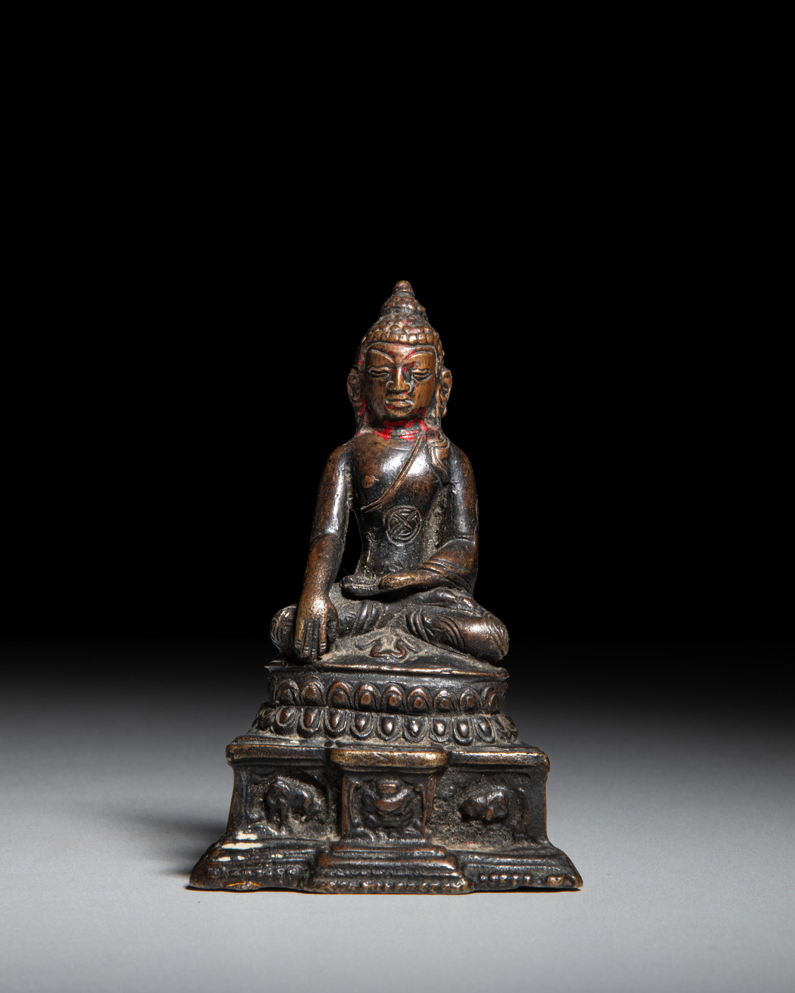 A BRONZE FIGURE OF THE BUDDHA SHAKYAMUNI Tibet, early-middle 20th Century depicts Buddha (1 of 3)