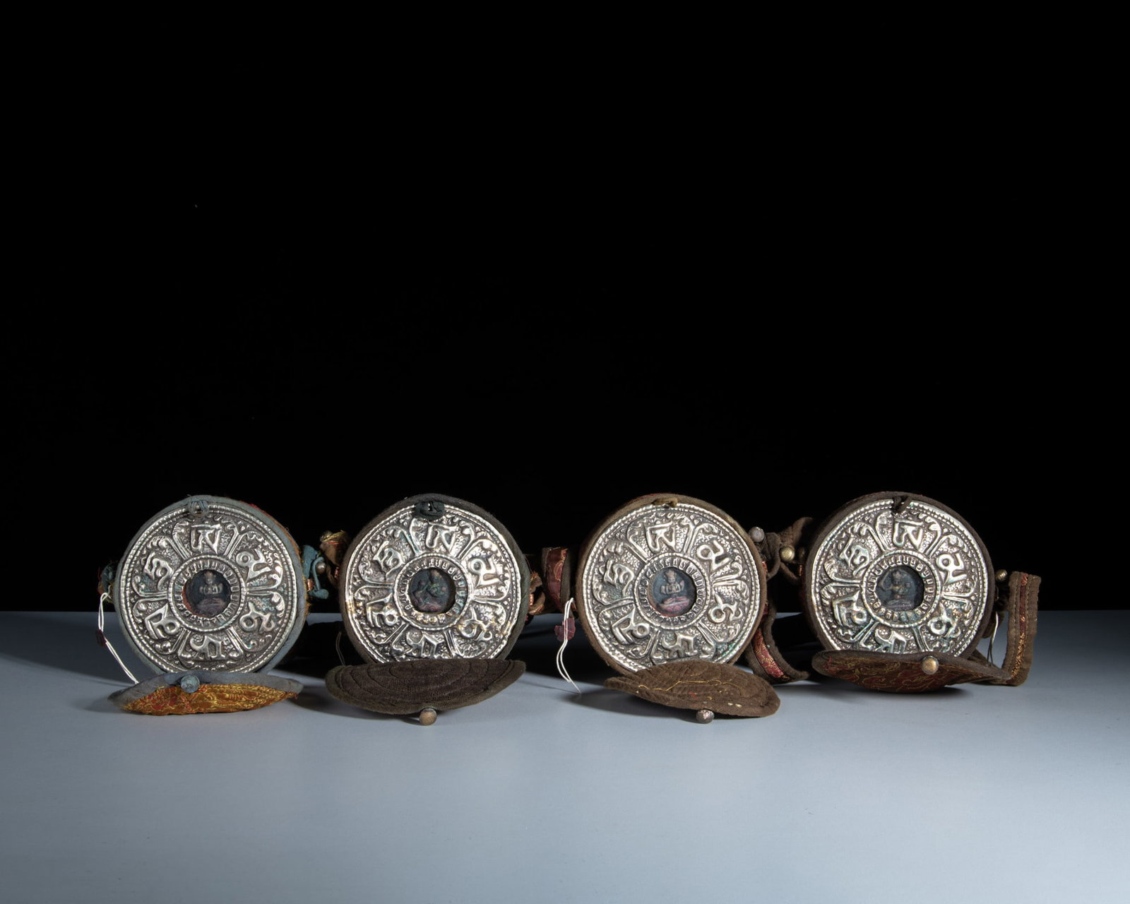 A SET OF FOUR SMALL CIRCULAR MIXED-METAL GAU BOXES WITH THEIR CONTENTS AND CLOTH COVERS Tibet or (1 of 1)