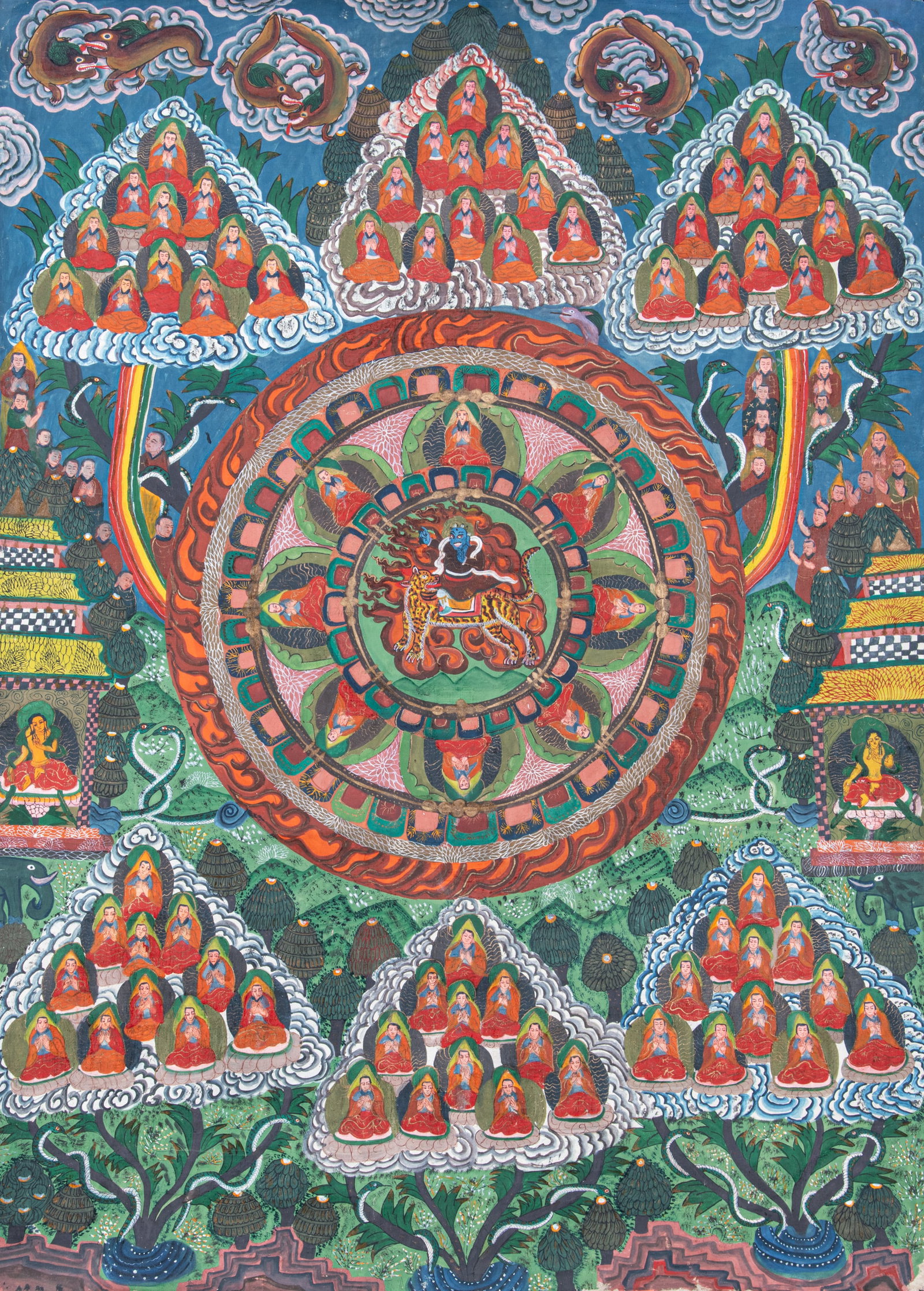 A POLYCHROME AND GILT THANGKA ON CLOTH DEPICTING THE MANDALA OF TSONGKHAPA SURROUNDED BY FIGURES OF (1 of 2)