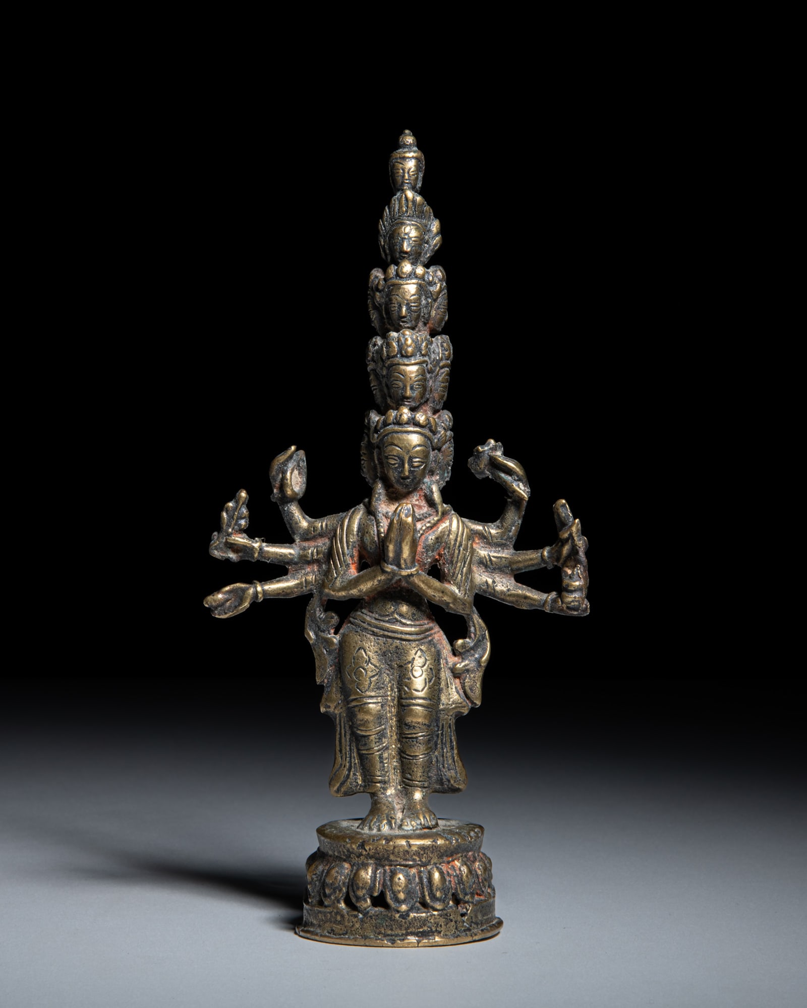 A COPPER ALLOY FIGURE OF EKADASHAMUKHA-AVALOKITESHVARA Nepal, early-middle 20th Century depicts (1 of 3)