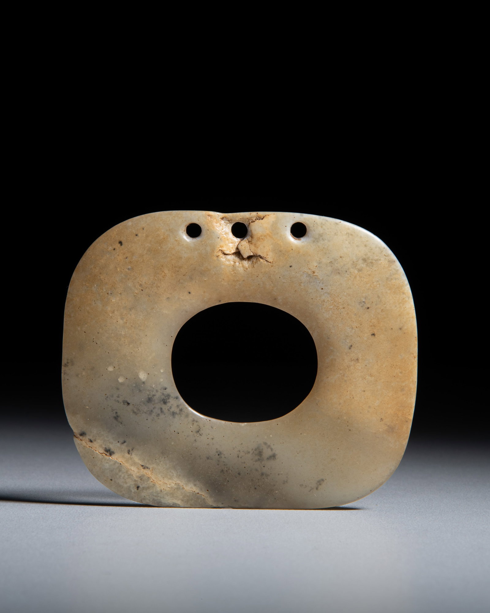 A GREENISH-YELLOW JADE DISC OF SQUARE FORM WITH ROUNDED CORNERS 红山文化 &#: A GREENISH-YELLOW JADE DISC OF SQUARE FORM WITH ROUNDED CORNERS 红山文化 米黄圆角方玉璧 China, Hongshan culture (BC4000-BC3000) Square