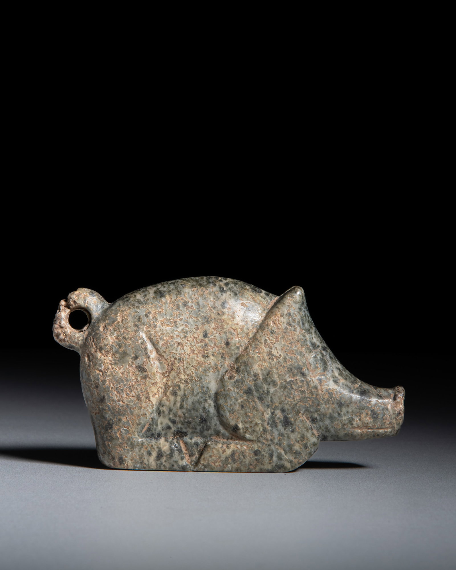 A CARVED CALCIFIED GREEN JADE PIG 商代 青玉猪 China, Shang dynasty (1 of 2)