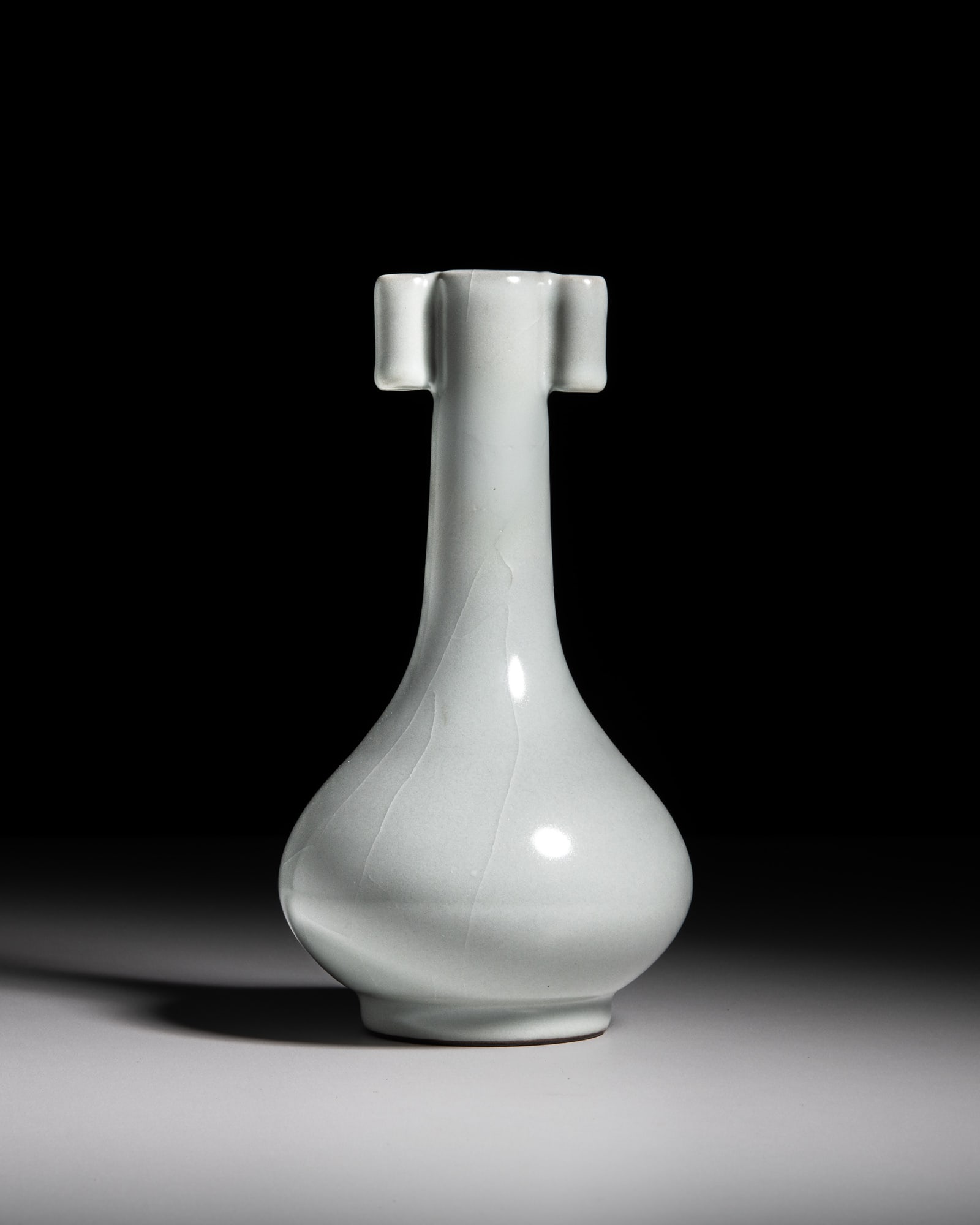 A GUAN-TYPE CELADON GLAZED BOTTLE VASE WITH TUBULAR HANDLES, INCISED QIANLONG MARK 清代 (1 of 3)