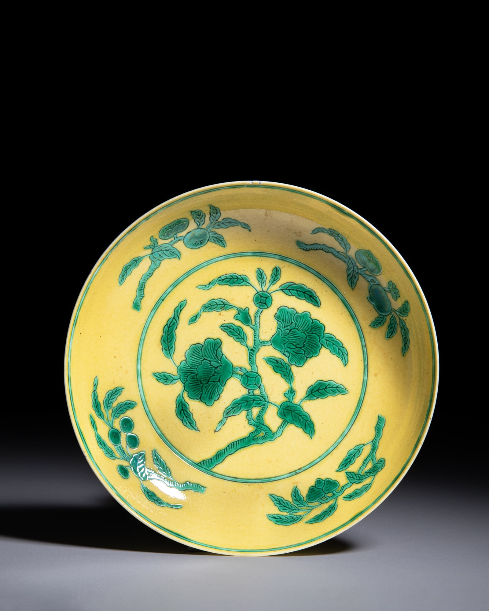 A YELLOW AND GREEN GLAZED 'FLOWERS AND FRUITS' DISH, MARK AND PERIOD OF JIAQING 清嘉 (1 of 3)