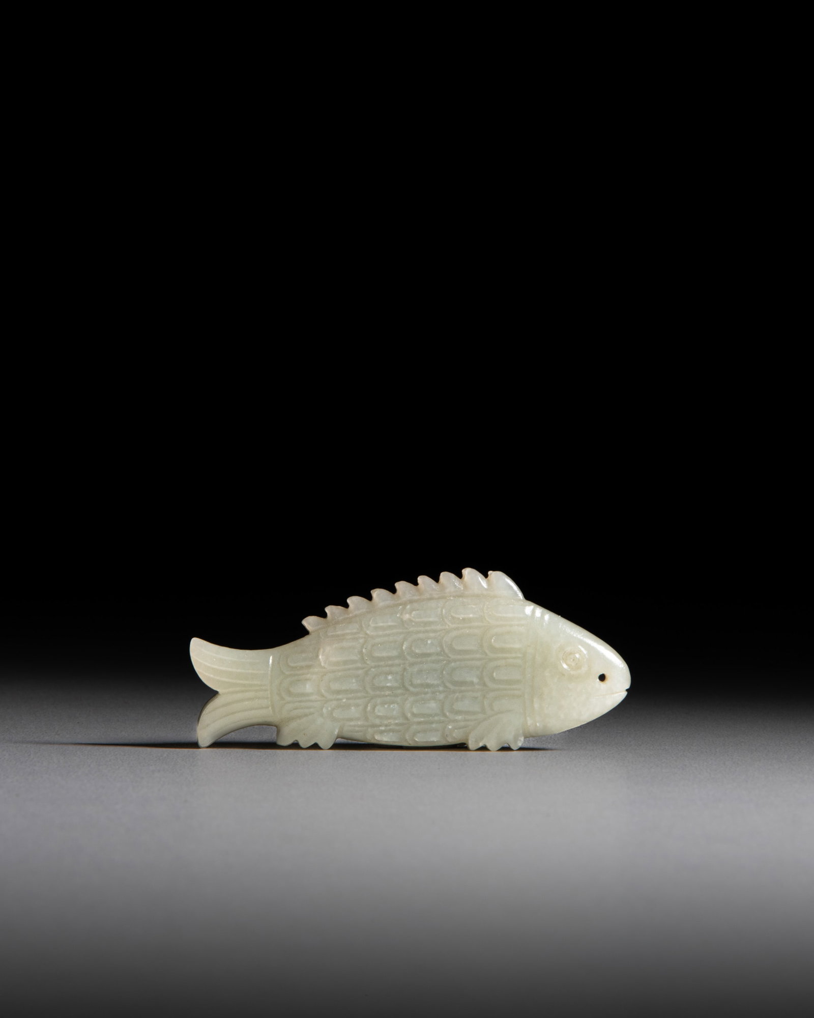 A VERY RARE PALE JADE CARVED FISH-SHAPE TALLY, 'YU FU' 清代 青玉符 (1 of 3)