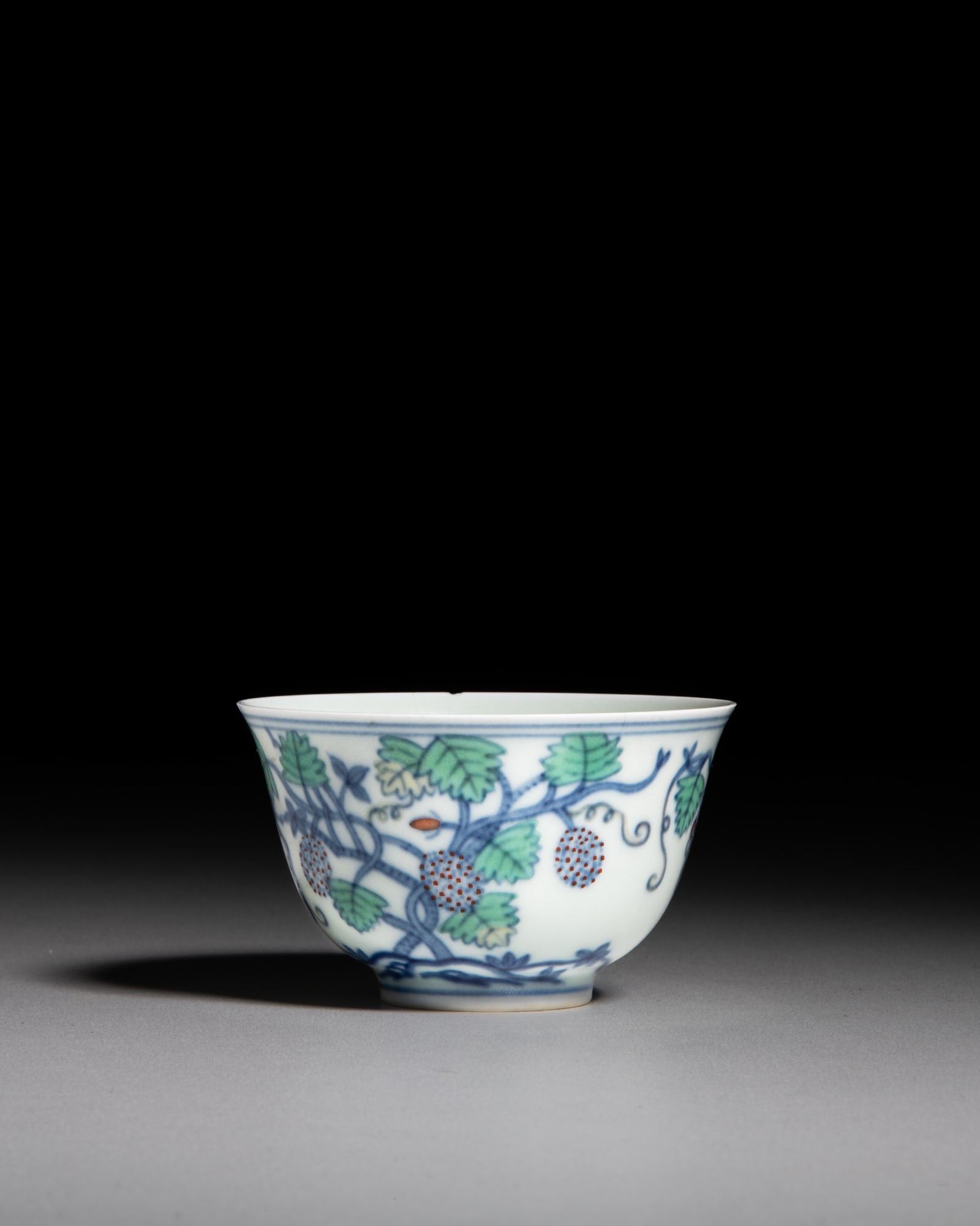 A FINE DOUCAI 'GRAPES AND LYCHEES' CUP, MARK 'CHENG HUA' 清中 ‘大明 (1 of 3)