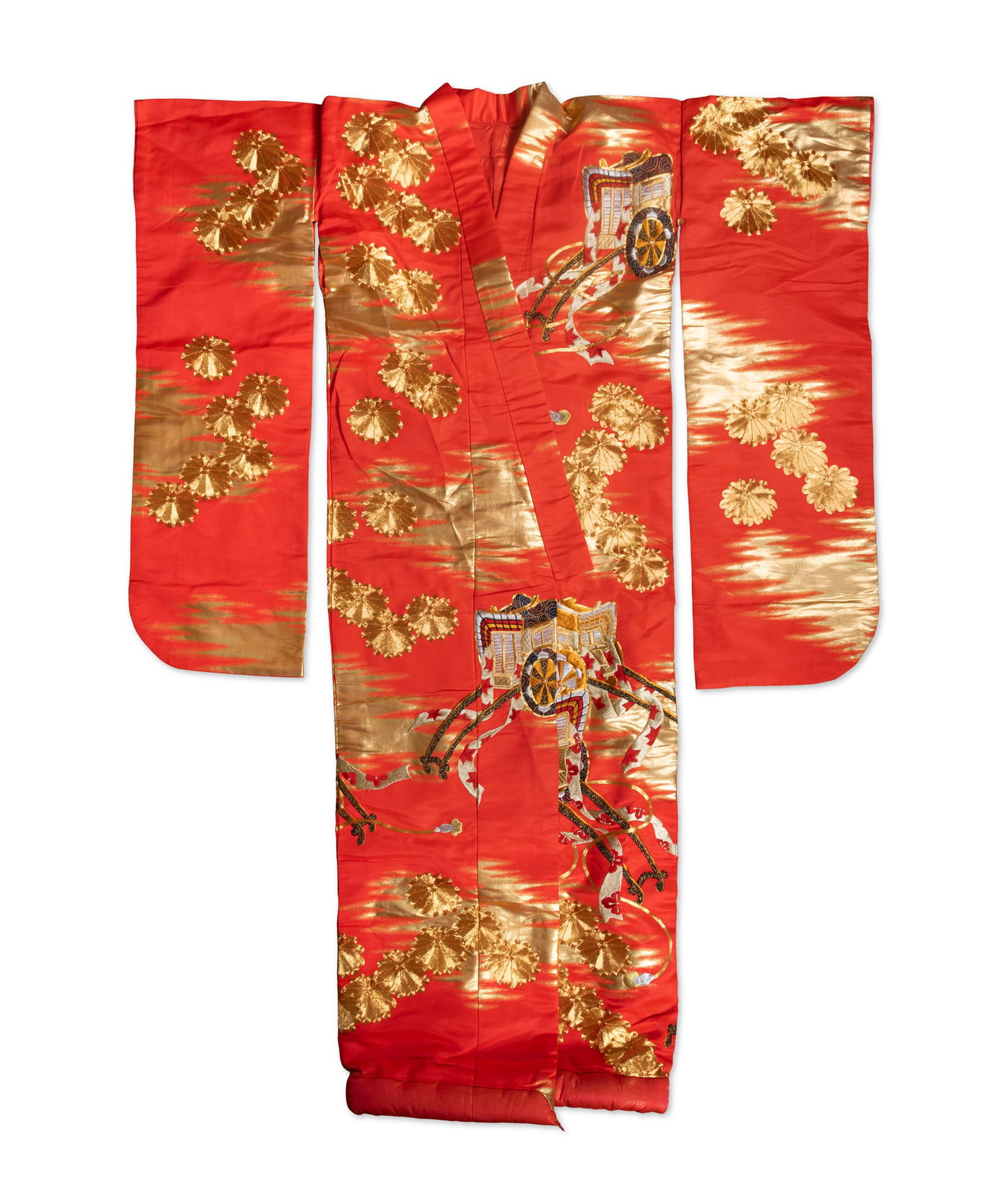 A JAPANESE RED-GROUND SILK UCHIKAKE Japan, mid-20th century, Shōwa period of traditional: A JAPANESE RED-GROUND SILK UCHIKAKE Japan, mid-20th century, Shōwa period of traditional form, woven with a vivid red silk ground enriched with gilt motifs, decorated overall with large chrysanth