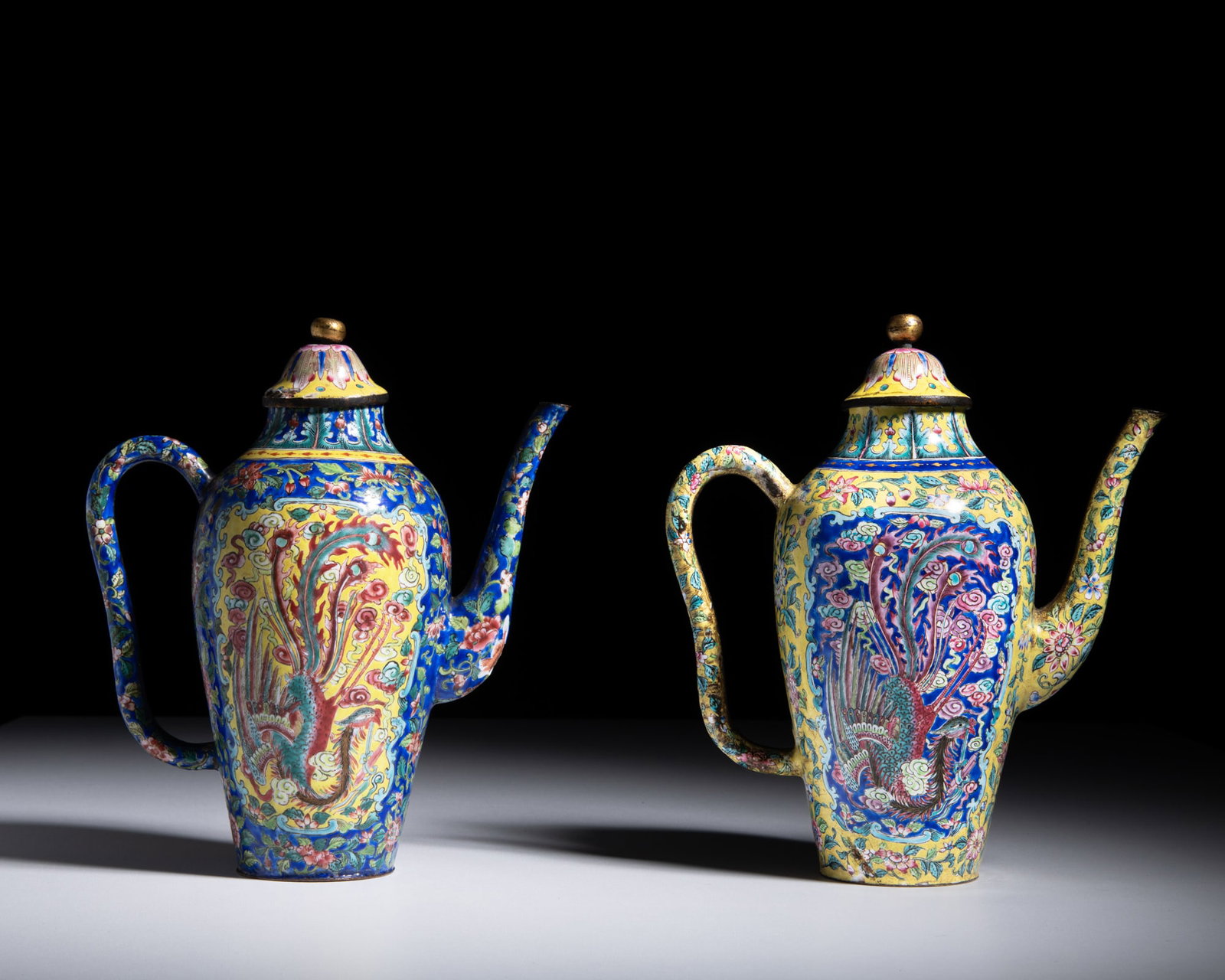 A PAIR OF IMPERIAL COPPER ENAMEL PAINTED ‘DRAGON AND PHOENIX’ COVERED EWERS Vietnam,: A PAIR OF IMPERIAL COPPER ENAMEL PAINTED ‘DRAGON AND PHOENIX’ COVERED EWERS Vietnam, Nguyễn dynasty, Minh Mạng mark and period (1820–1840) Finely painted in polychrome en