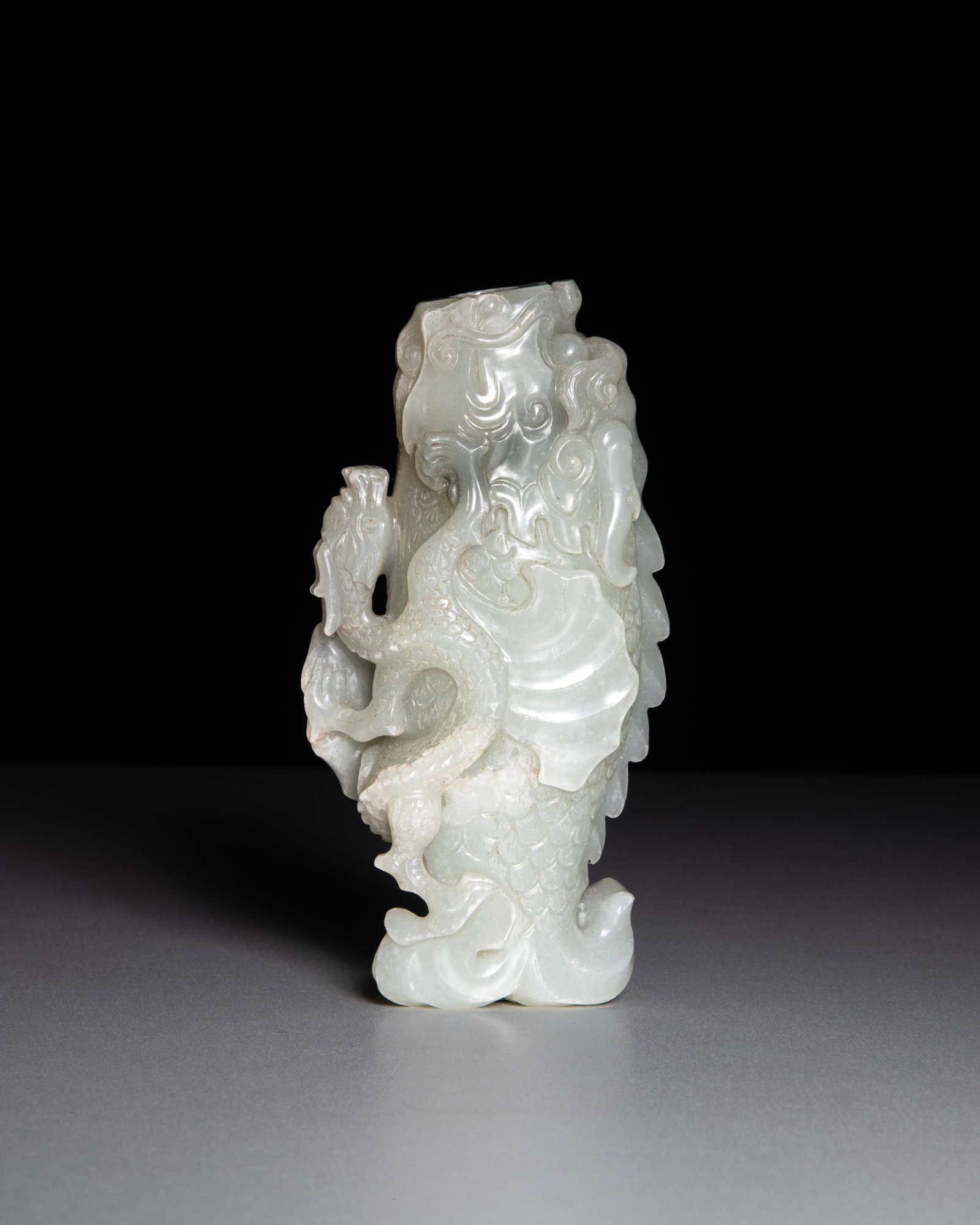 A RETICULATED CELADON JADE ‘DRAGON AND FISH’ VASE 清代 青白 (1 of 2)