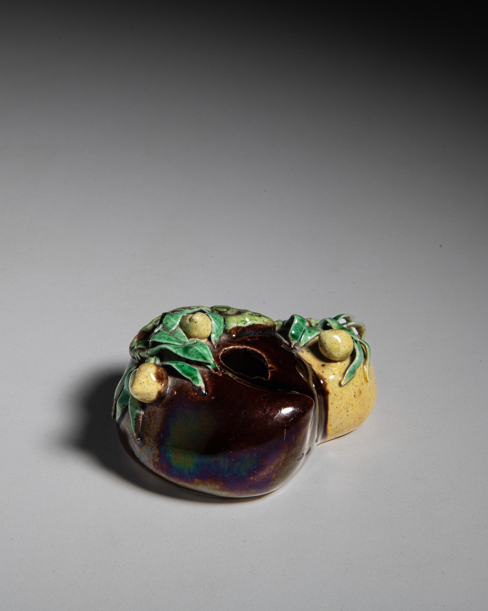 A THREE-COLOUR GLAZED PEACH-SHAPED BISCUIT WATER POT, MARKED 'WANG FU LONG' 晚清 (1 of 3)