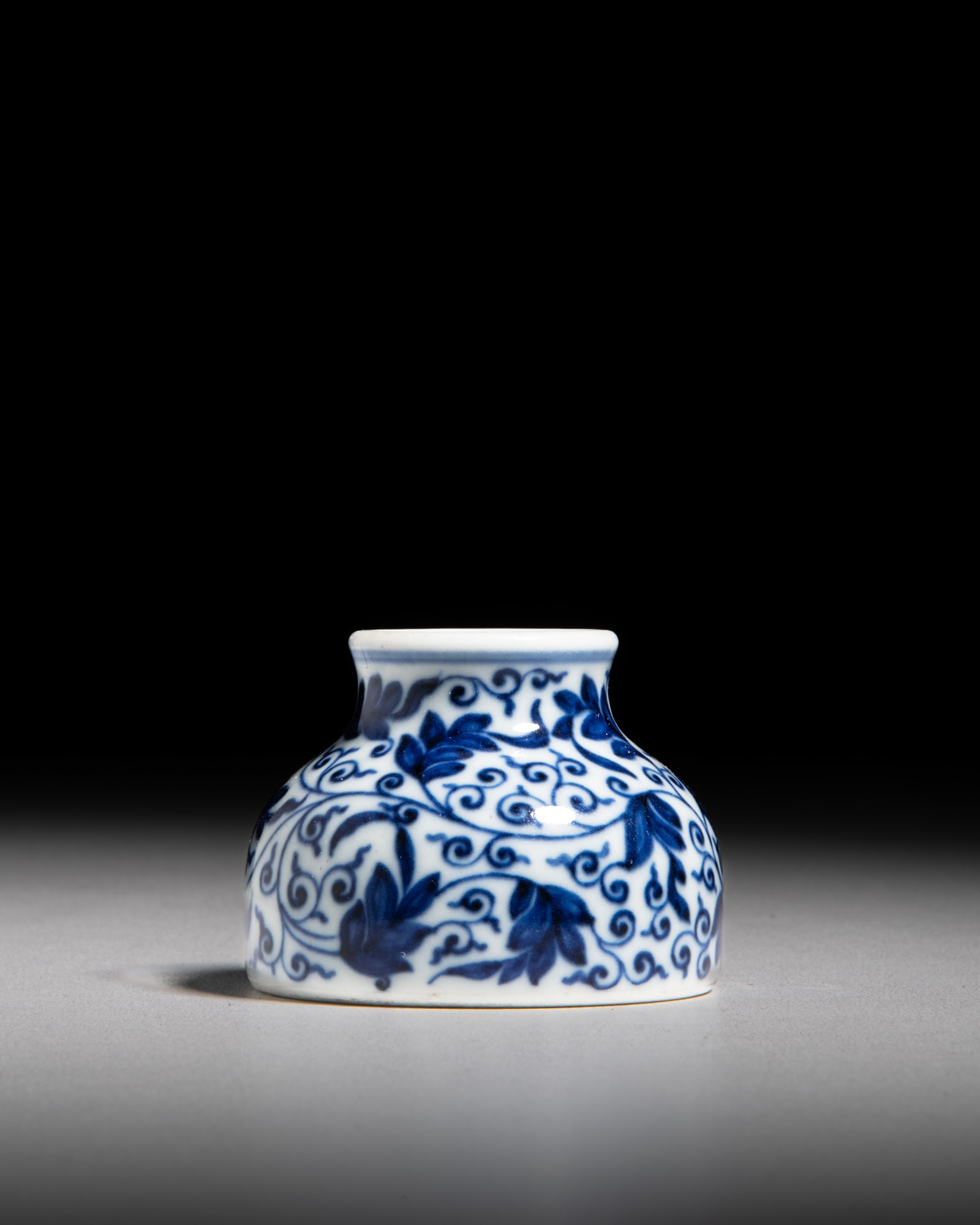 A FINE BLUE AND WHITE WATER POT WITH SCROLLING FOLIATE DECORATION, MARK AND PERIOD OF YONGZHENG (1 of 3)