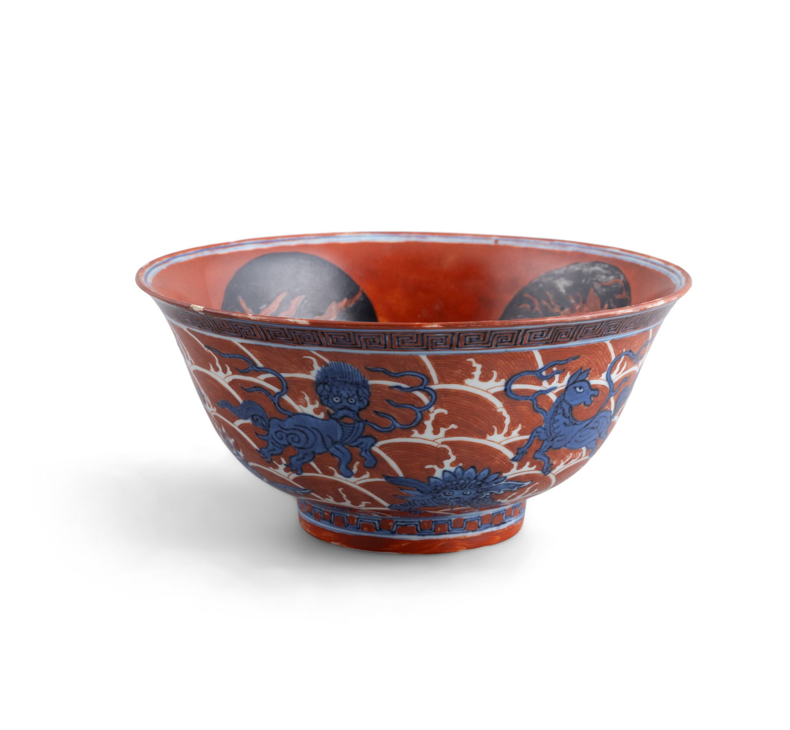 AN IRON RED AND UNDERGLAZE BLUE BOWL China, Kangxi style of deep circular form, the interior (1 of 6)