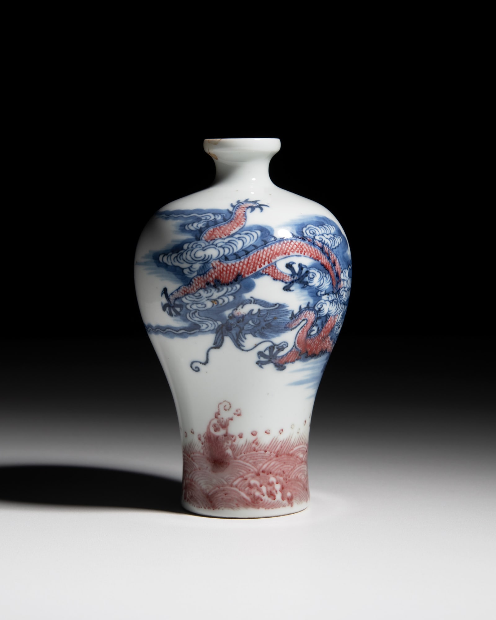 A COPPER RED BLUE AND WHITE 'DRAGON AND CARP' MEIPING 青花釉里红 (1 of 2)