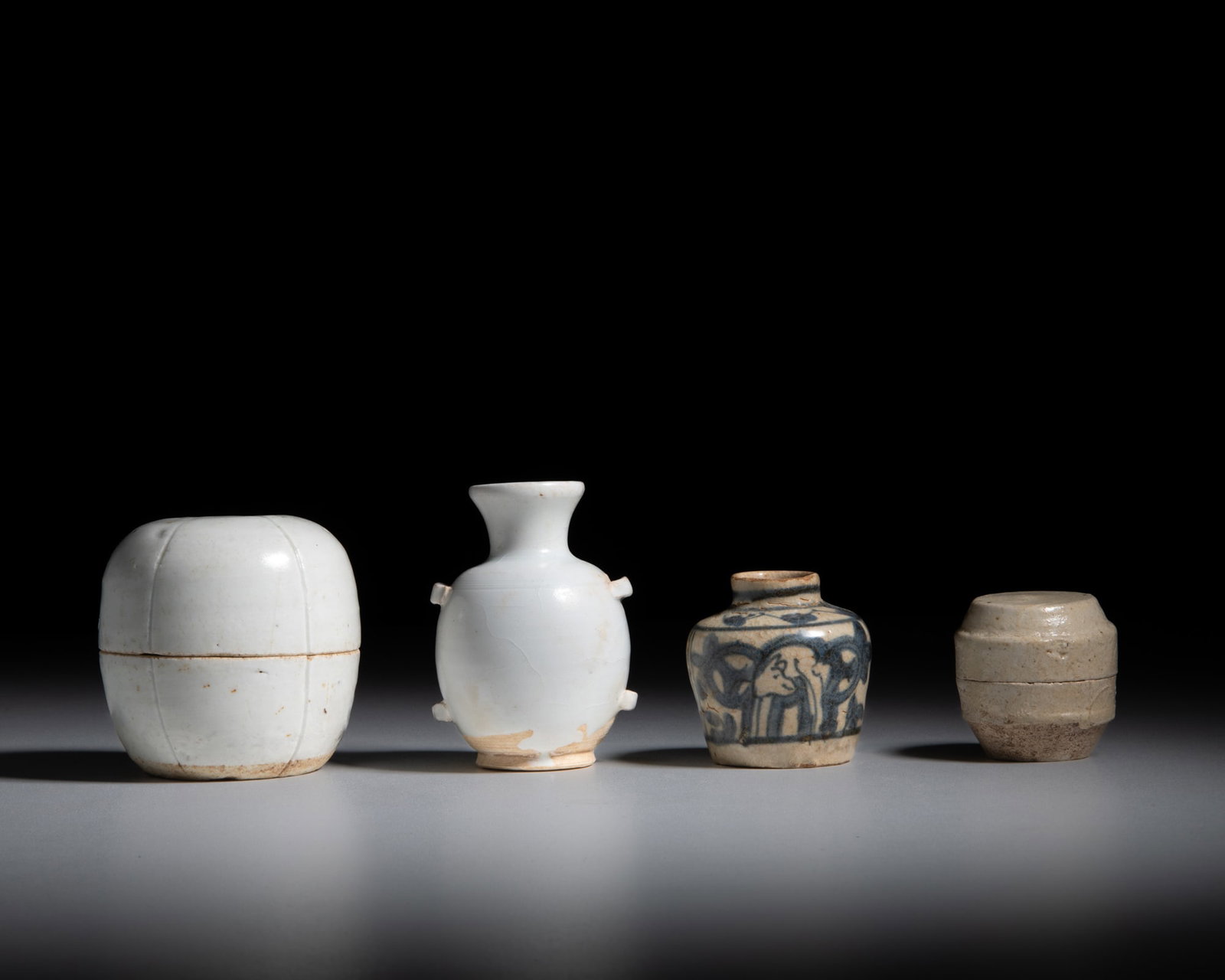 A COLLECTION OF FOUR CERAMICS China and Southern Asia comprising a qingbai lobed melon-shaped (1 of 1)