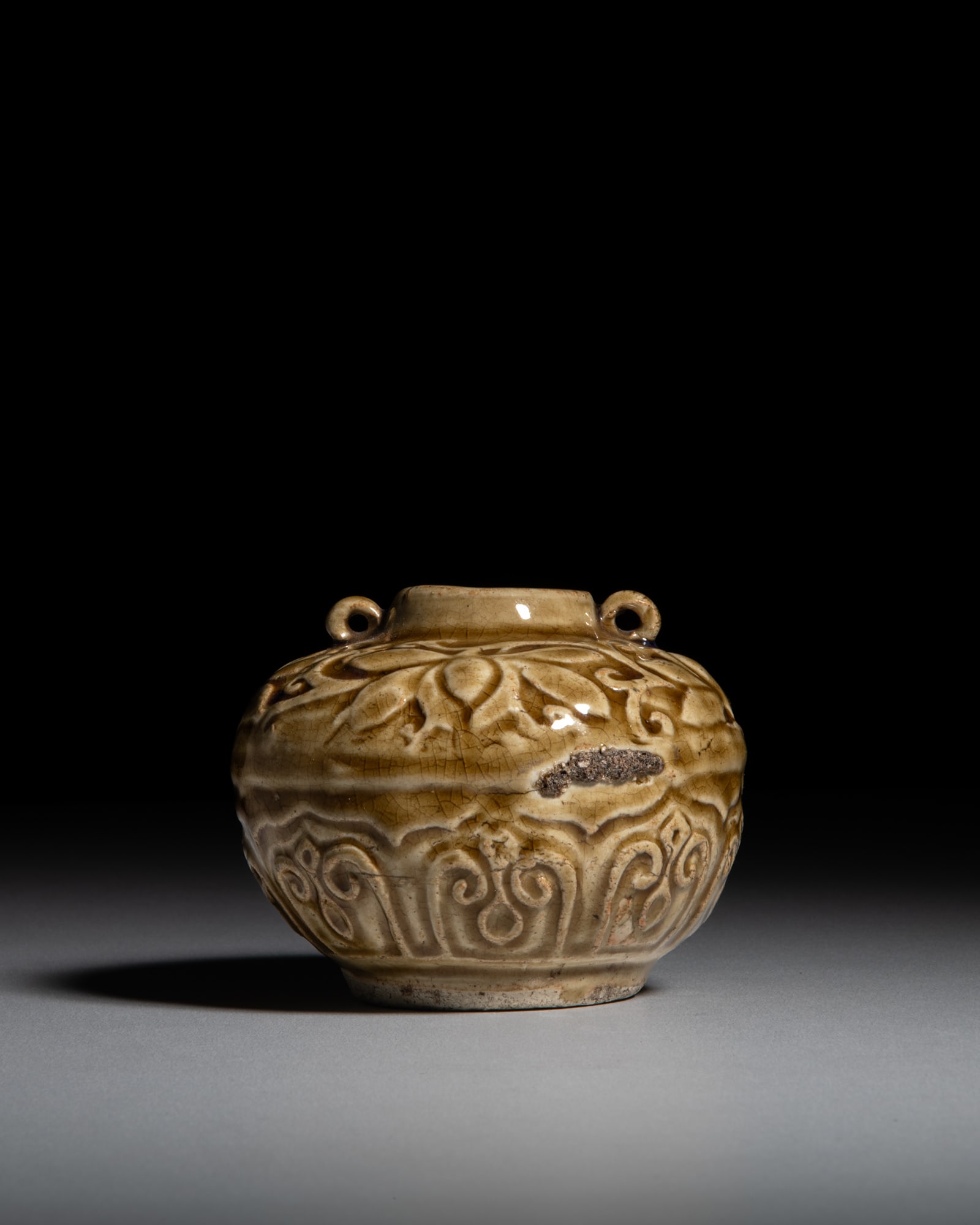 A SMALL CARVED BROWN-GLAZE 'LOTUS' JAR Vietnam or Southern East Asia, 19th century H.7.4cm (1 of 2)