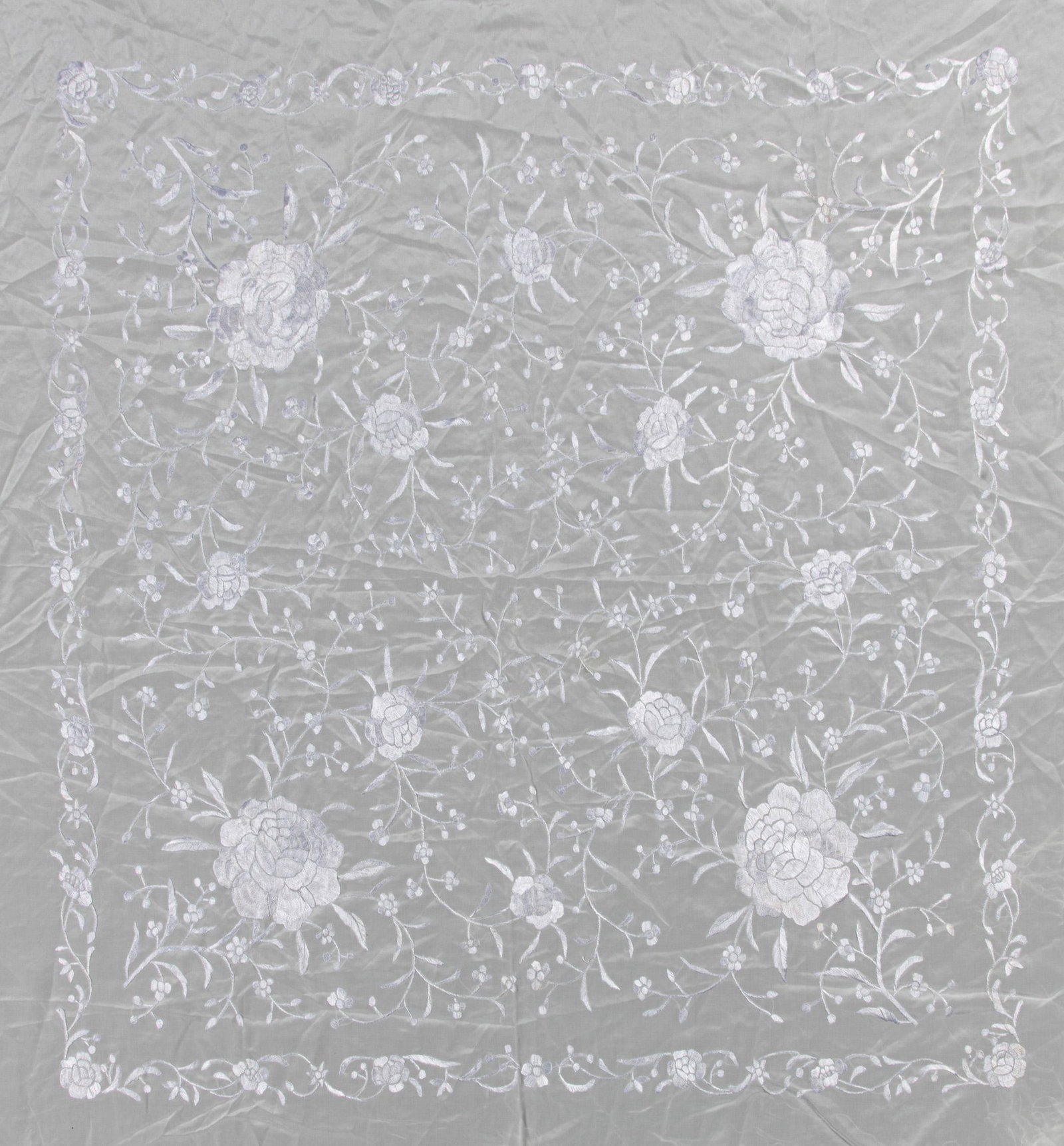 TWO BLACK AND WHITE-GROUND SILK SHAWLS WITH SILVERED AND CREAM THREAD-EMBROIDERED ‘ (1 of 2)