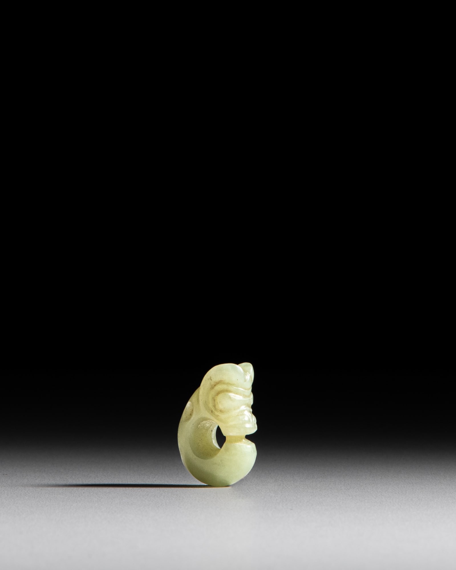 A TINY HONGSHAN STYLE CELADON JADE PIG DRAGON China, 20th century H.2.8cm ***PLEASE NOTE: THIS (1 of 1)