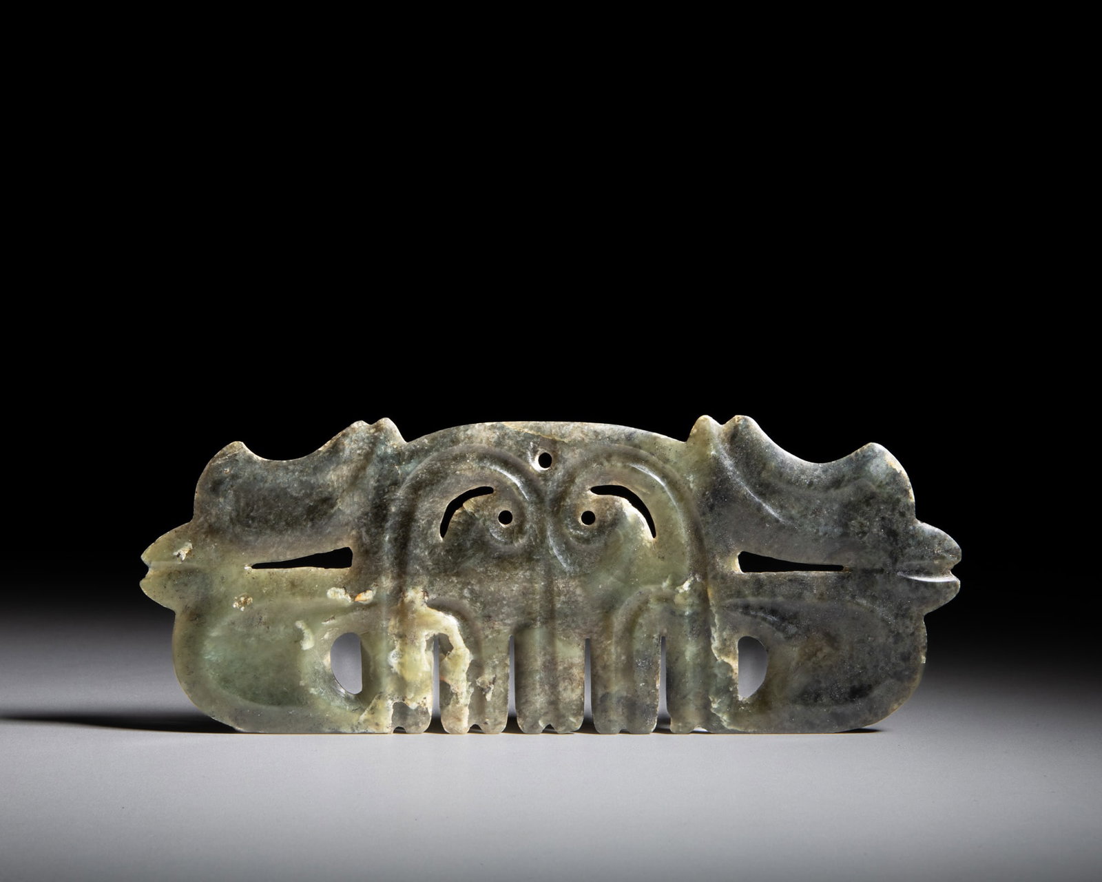 A CELADON JADE AND RUSSET ‘CLOUD-SCROLL’ ORNAMENT 红山文化Ƈ (1 of 5)