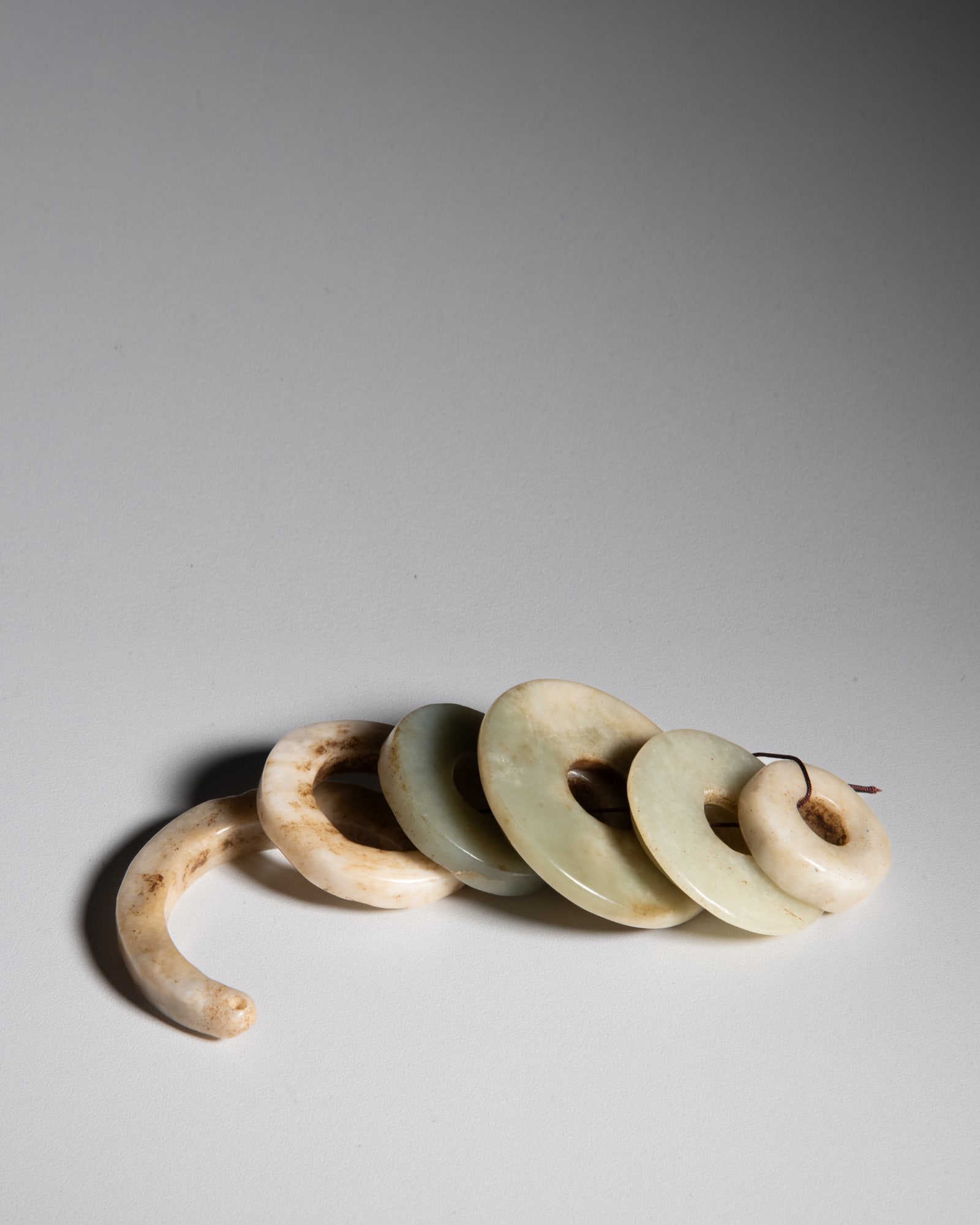 A GROUP OF EIGHT CELADON JADE DISCS, HUAN 青玉环一组八件 (1 of 1)