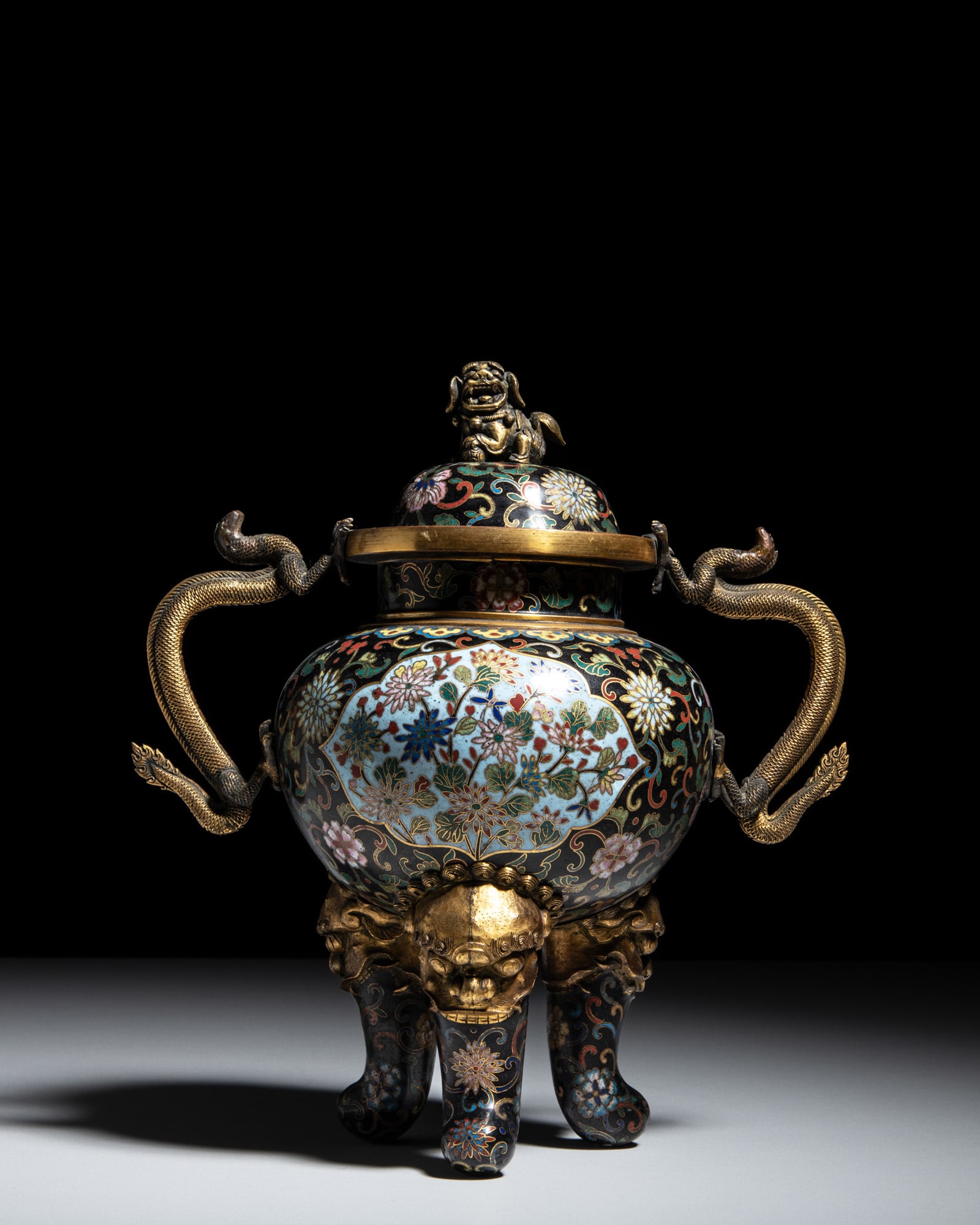 A GILT COPPER CLOISONNÉ TRIPOD INCENSE BURNER AND COVER, DECORATED WITH LOTUS ON A BLACK GROUND (1 of 2)