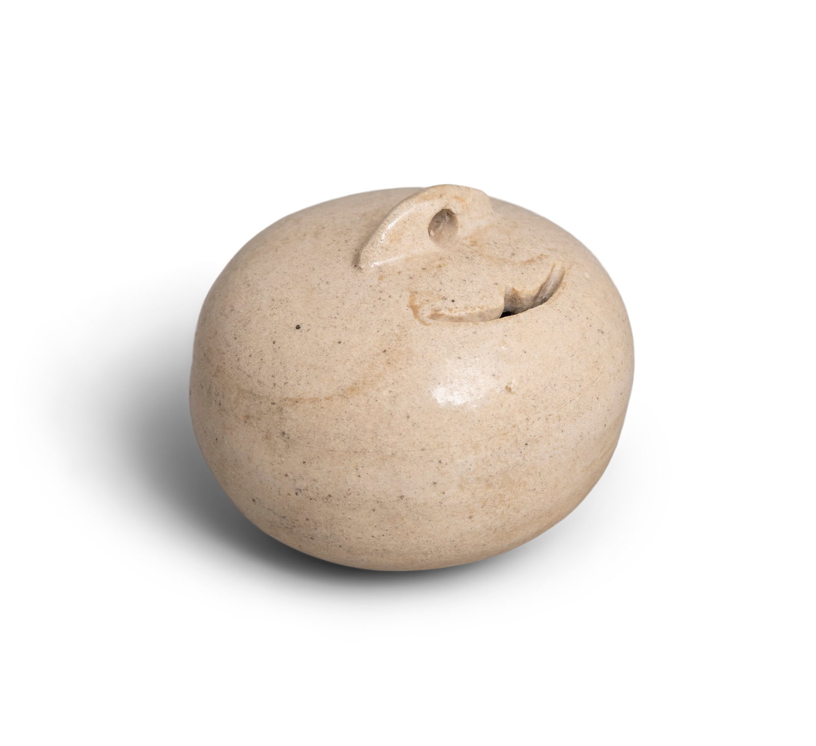 A RARE CREAMY GLAZED COIN BANK 'PUMAN' 唐代 陶扑满 China, Tang dyn: A RARE CREAMY GLAZED COIN BANK 'PUMAN' 唐代 陶扑满 China, Tang dynasty D.6.6cm