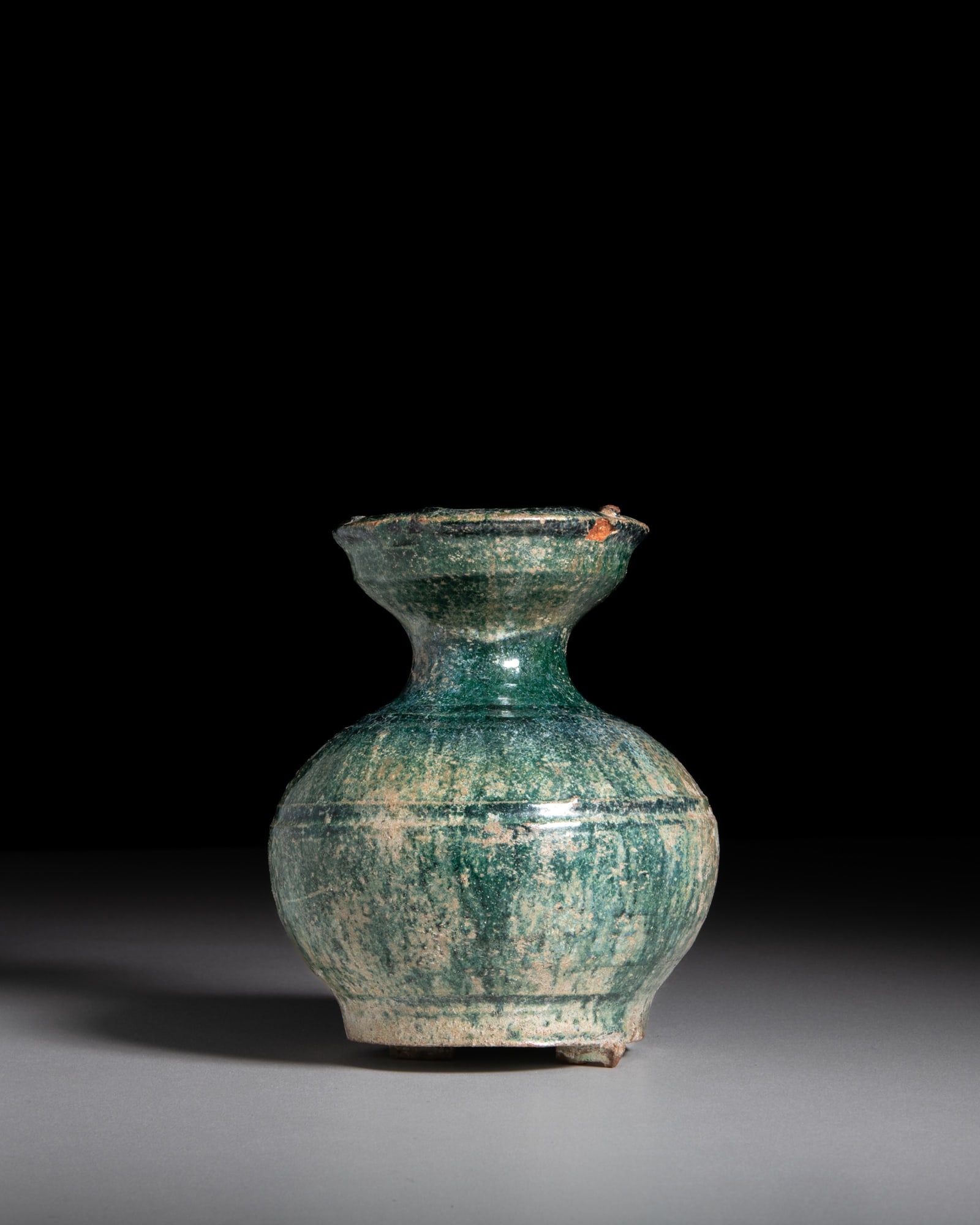 A GREEN-GLAZE POTTERY VASE 汉代 绿釉弦纹小陶瓶: A GREEN-GLAZE POTTERY VASE 汉代 绿釉弦纹小陶瓶 China, Han dynasty (206 BC–220 AD) H.12.5cm