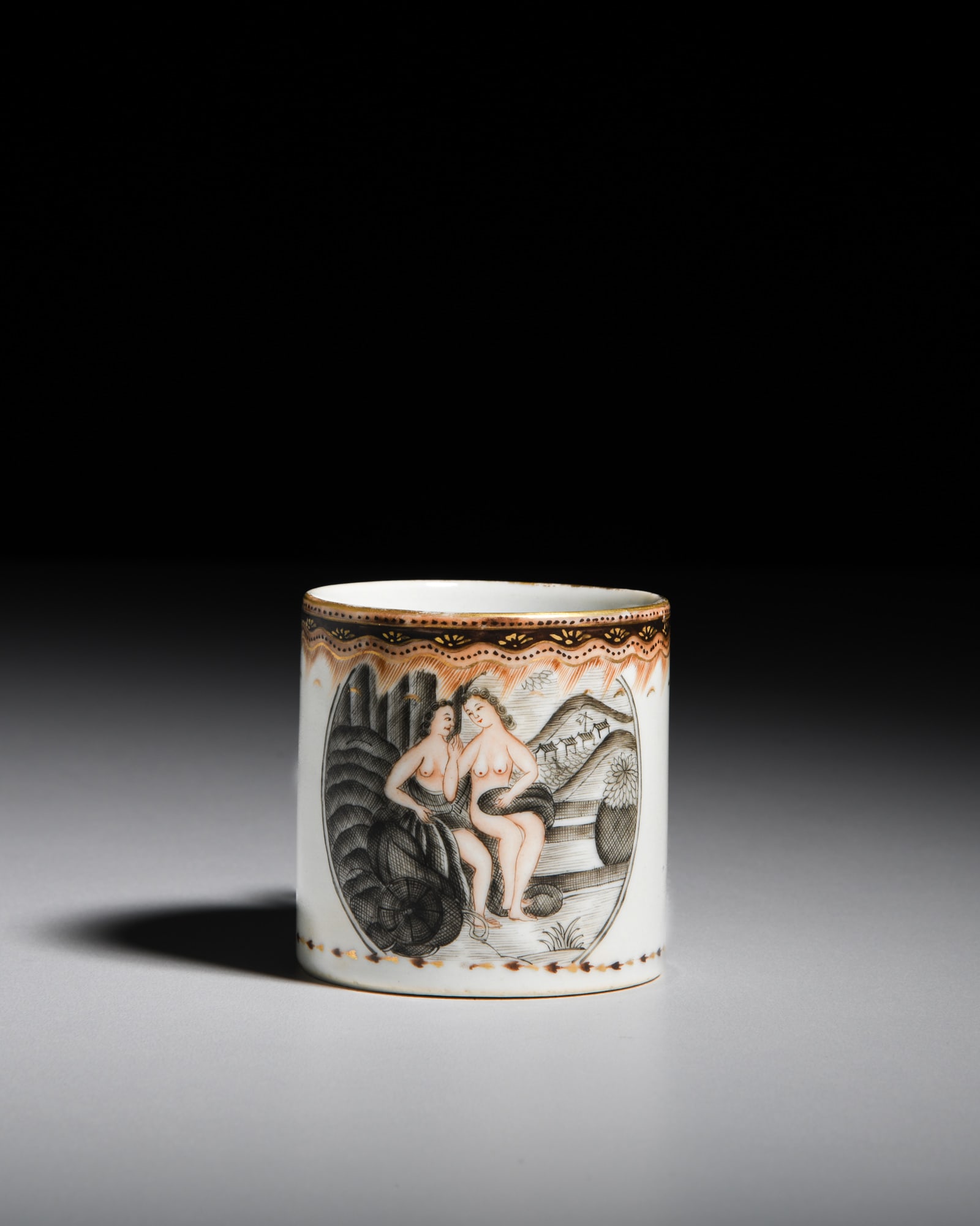 A GILT AND INK DECORATED 'TWO NAKED EUROPEAN LADIES' COFFEE CUP China for Europe, 18th century: A GILT AND INK DECORATED 'TWO NAKED EUROPEAN LADIES' COFFEE CUP China for Europe, 18th century H.6.3cm ***PLEASE NOTE: THIS LOT IS NOT ON VIEW IN IRELAND. POST-SALE COLLECTION IS TO BE ARRANGED BY