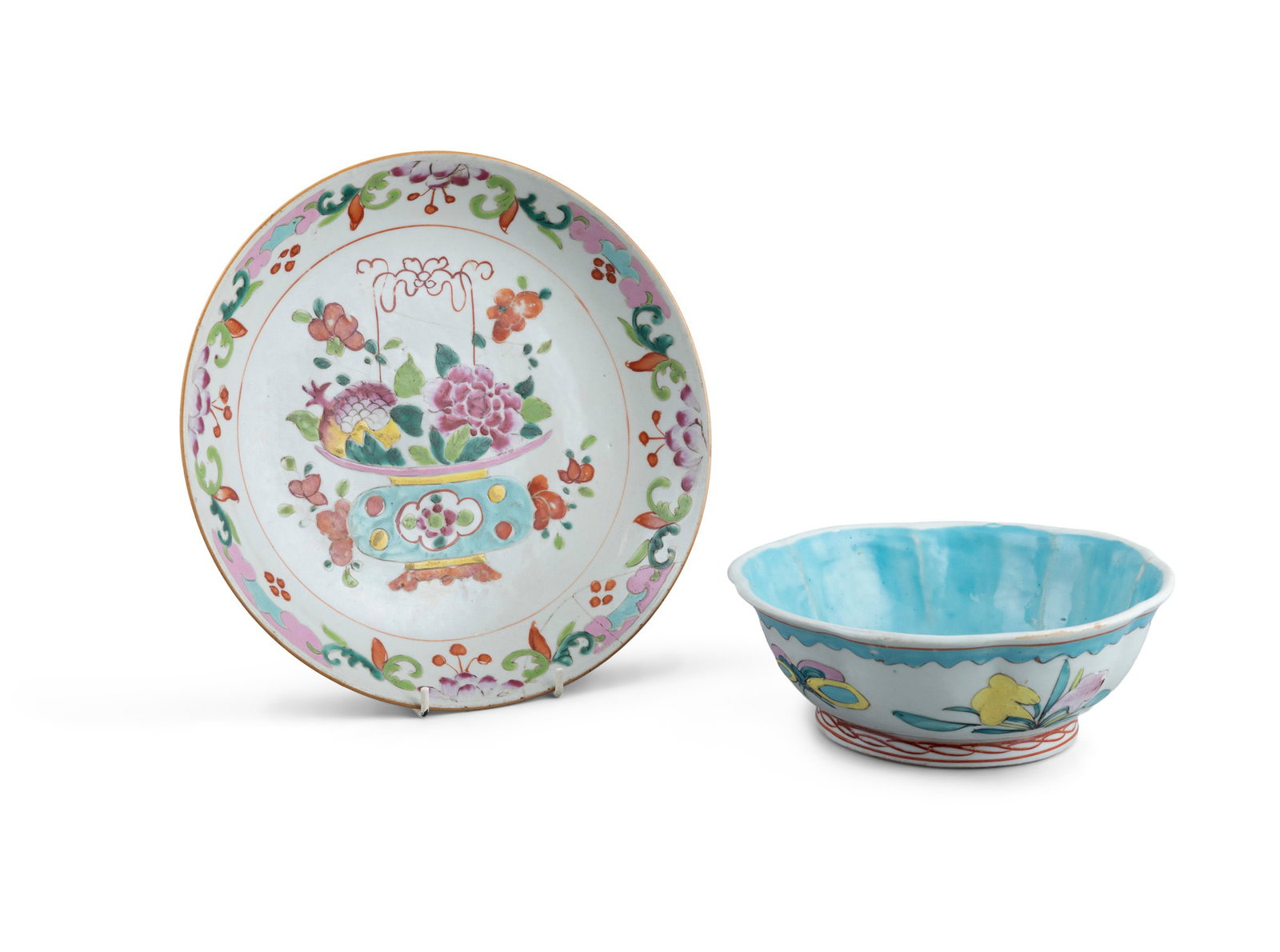 TWO FAMILLE ROSE PORCELAINS China, 19-20th century including a 'basket of flowers' charger with: TWO FAMILLE ROSE PORCELAINS China, 19-20th century including a 'basket of flowers' charger with a wood stand and a lobed 'butterflies' fruit bowl D.28 and 20.8cm