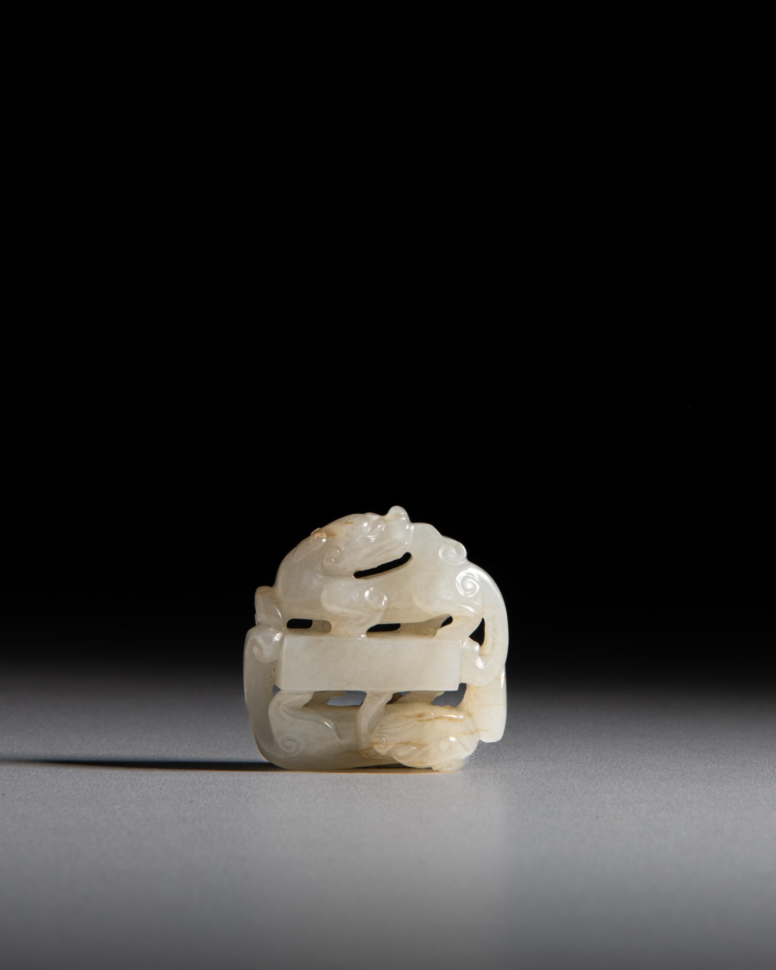 A CELADON RETICULATED DOUBLE CHILONG JADE PENDANT 清代 青玉透 (1 of 2)