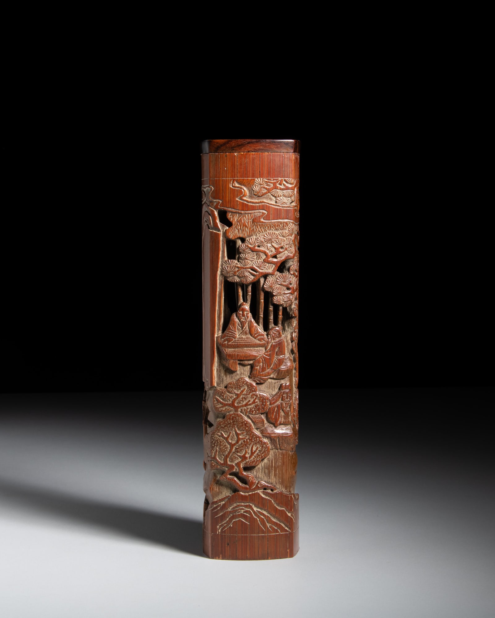 A RETICULATED AND CARVED SQUARE-SHAPED BAMBOO ‘SEVEN SCHOLARS’ INCENSE BURNER 晚: A RETICULATED AND CARVED SQUARE-SHAPED BAMBOO ‘SEVEN SCHOLARS’ INCENSE BURNER 晚清 竹雕‘竹林七贤’四方香筒