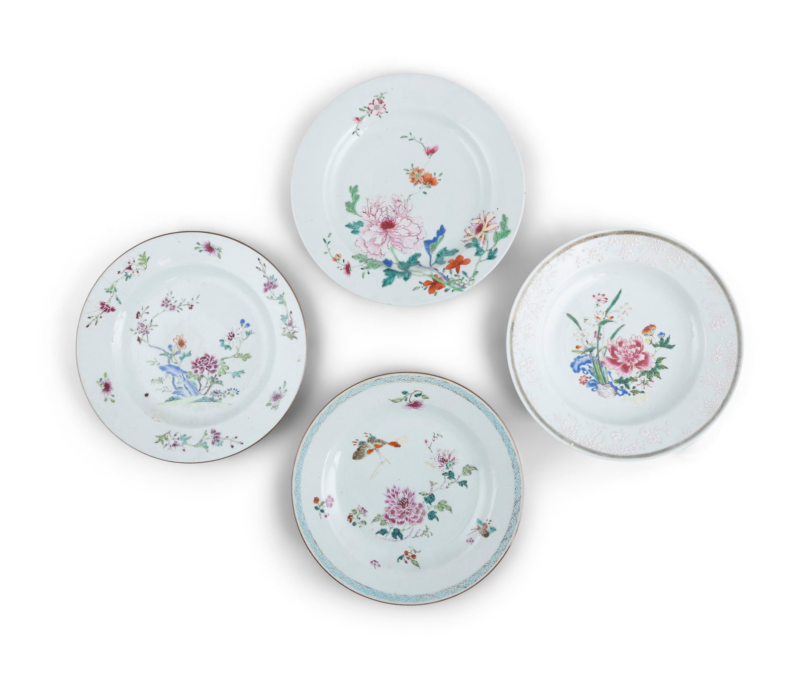 A COLLECTION OF FOUR FAMILLE ROSE PORCELAIN DISHES, QIANLONG PERIOD, each of circular form,: A COLLECTION OF FOUR FAMILLE ROSE PORCELAIN DISHES, QIANLONG PERIOD, each of circular form, decorated with stylised flower groups in various coloured enamels, one with turquoise cross-hatch border, 23