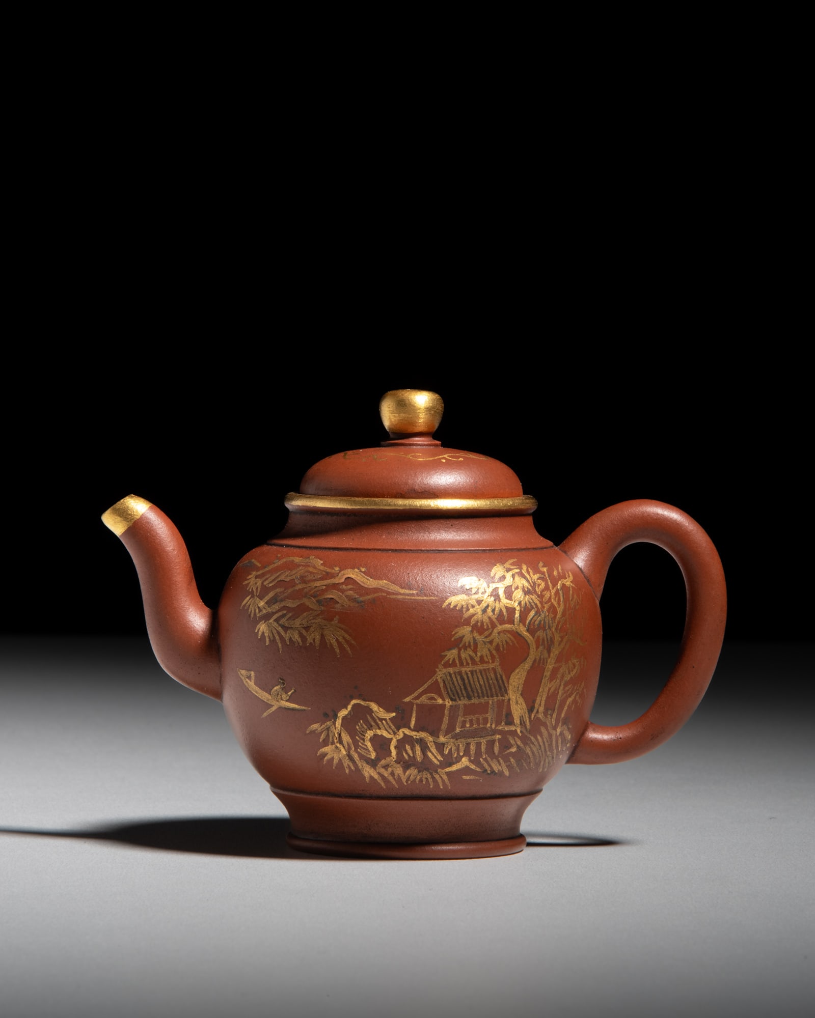 A PARTLY GILT ‘LANDSCAPE AND SCHOLAR’ ZISHA TEAPOT, MARKED QIANLONG 乾隆: A PARTLY GILT ‘LANDSCAPE AND SCHOLAR’ ZISHA TEAPOT, MARKED QIANLONG 乾隆年制款 高士山水纹紫砂灯笼壶