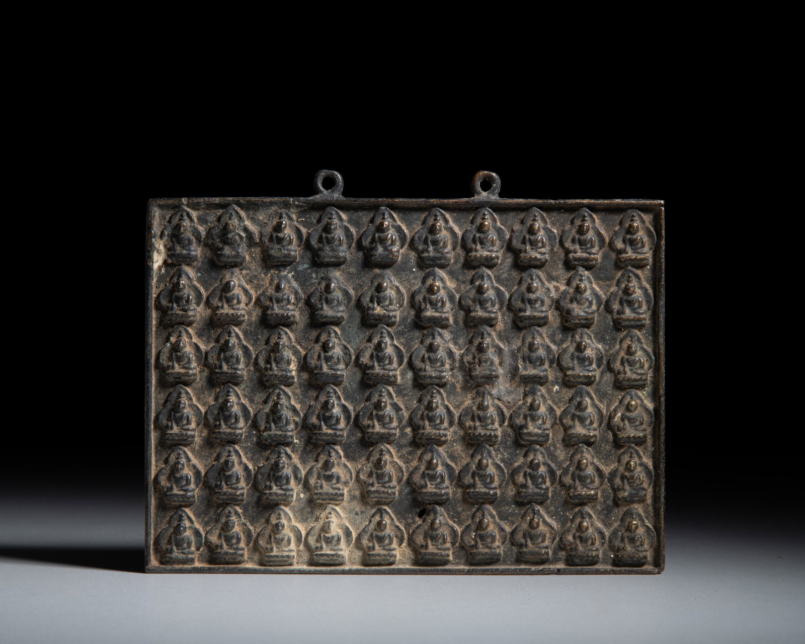 A COPPER ALLOY 'THOUSAND BUDDHAS' PLAQUE, Nepal, middle 20th Century Depicting sixty small figures (1 of 1)
