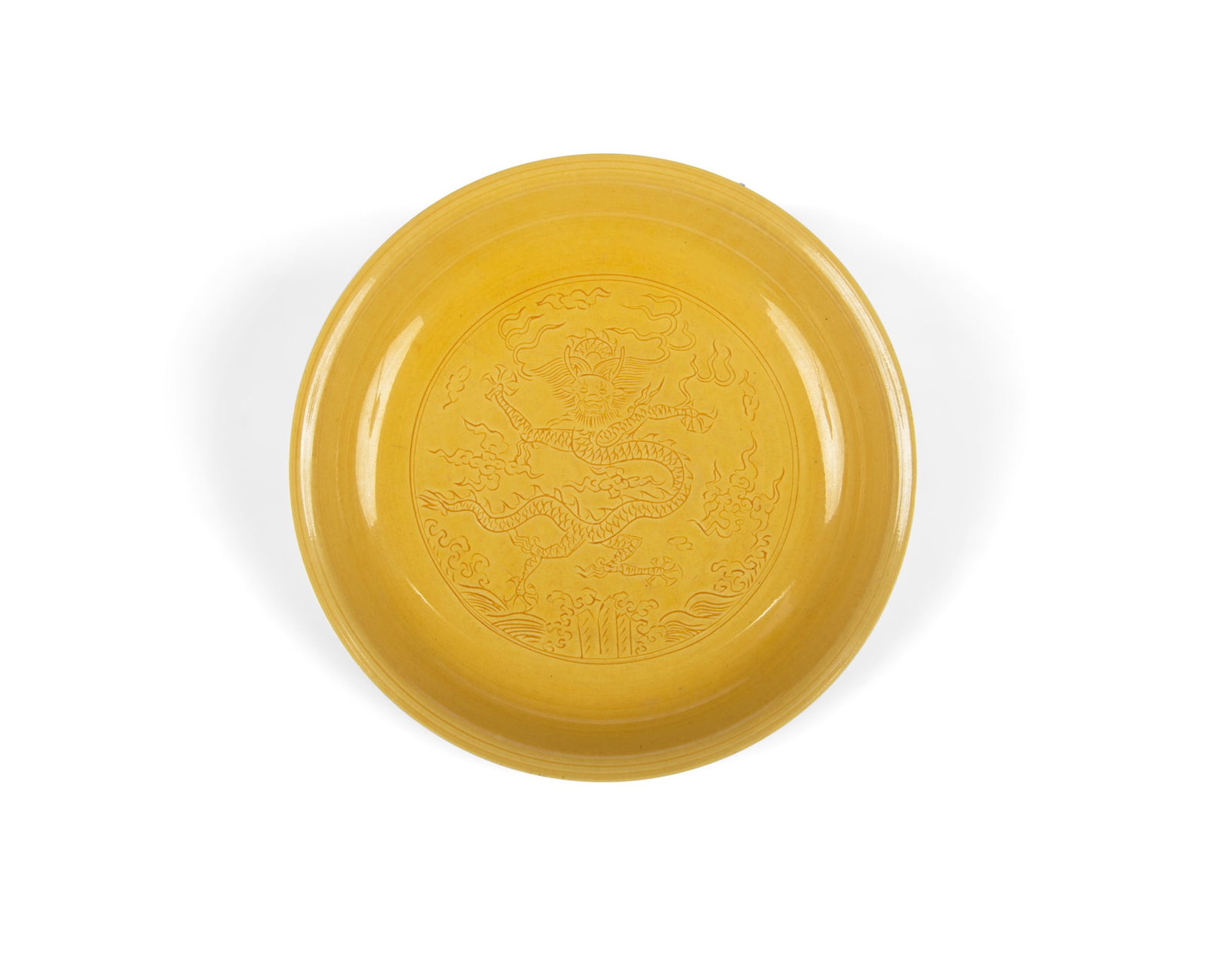 A YELLOW GLAZED 'DRAGON' DISH, Marked Jiajing 20世纪 嘉靖款 黄&: A YELLOW GLAZED 'DRAGON' DISH, Marked Jiajing 20世纪 嘉靖款 黄釉暗刻龙纹盘 China, 20th century D.23cm ***PLEASE NOTE THAT THIS L