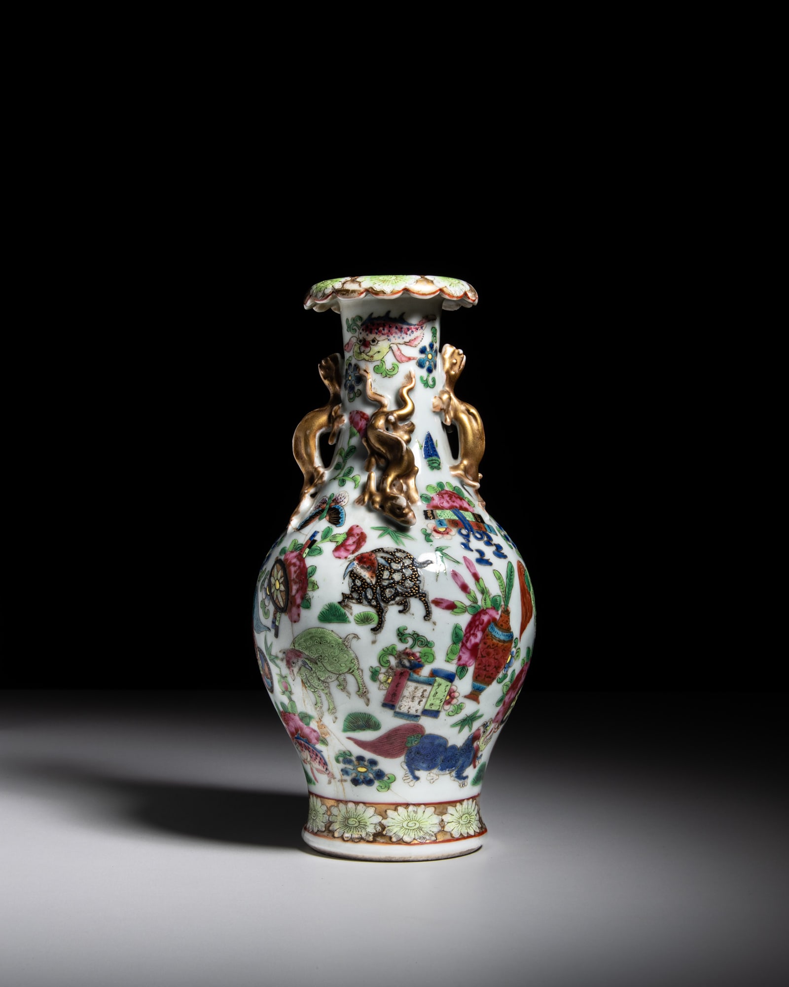 A SMALL GILT AND FAMILLE ROSE 'MYTHICAL ANIMAUX' VASE 晚清 粉彩描: A SMALL GILT AND FAMILLE ROSE 'MYTHICAL ANIMAUX' VASE 晚清 粉彩描金神兽纹螭龙耳瓶 China, late Qing dynasty H.22.5cm