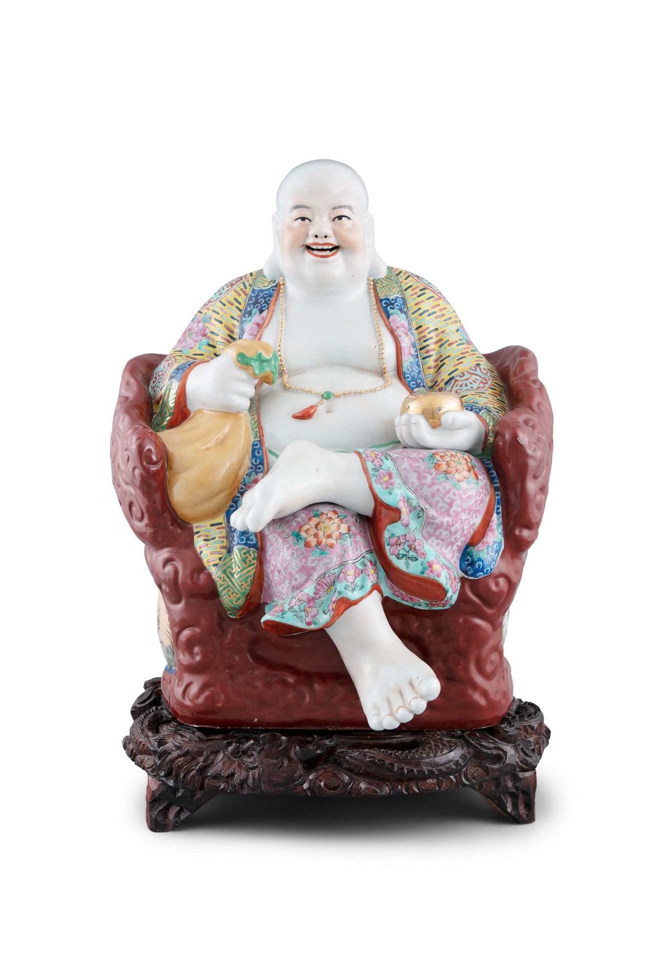 A LARGE CHINESE PORCELAIN FIGURE, 20th century, of a seated 'Hotei', famille rose palette, wearing a: A LARGE CHINESE PORCELAIN FIGURE, 20th century, of a seated 'Hotei', famille rose palette, wearing a gold bead necklace holding a pouch and incense pot, on carved wood base, the entire item measuring 