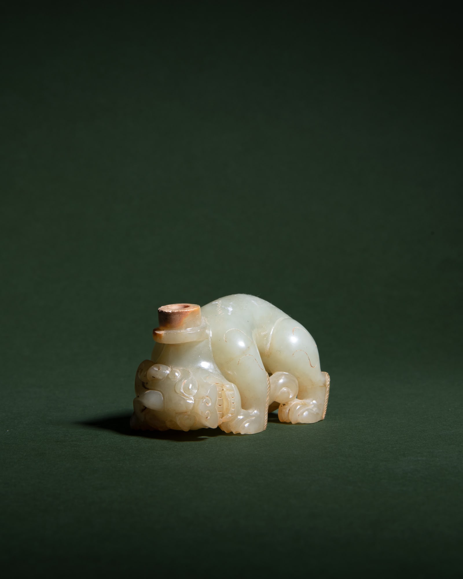 AN ARCHAIC STYLE CELADON JADE LAYING BIXIE 明国仿汉 青玉辟 (1 of 3)