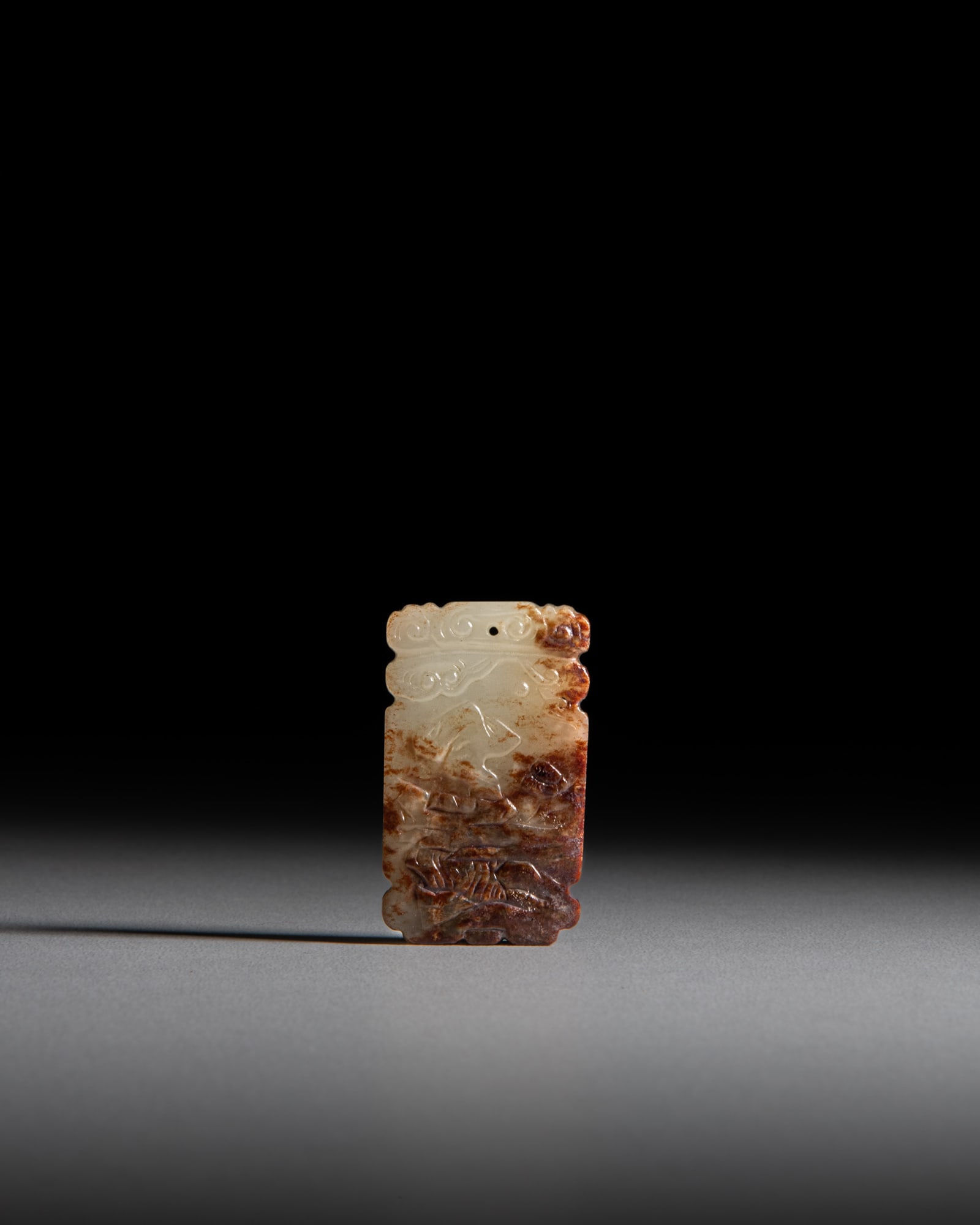 A CELADON AND RUSSET 'SCHOLAR AND FLOWER' JADE PENDANT 清代 青玉带: A CELADON AND RUSSET 'SCHOLAR AND FLOWER' JADE PENDANT 清代 青玉带沁色赏梅图玉佩 China, Qing dynasty Size.4.5x2.1cm
