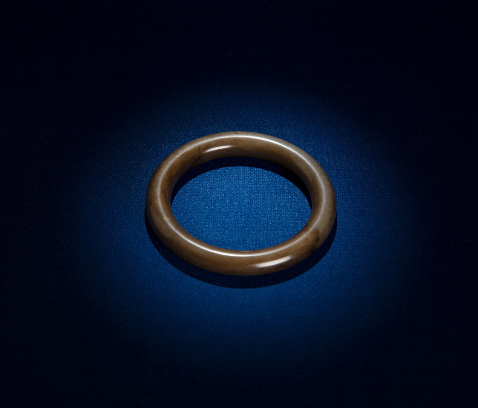 A GREYNISH JADE BANGLE China, Qing dynasty D.(outside)8.6cm - (inside)6.4cm (1 of 2)