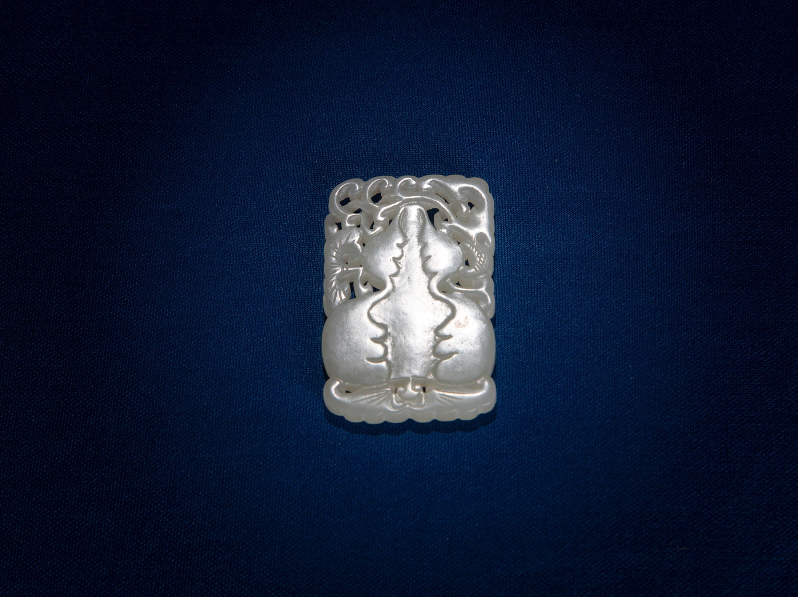 A RETICULATED CELADON JADE GOURDE PENDANT China, 19th century Size.5.3x3.3cm (1 of 1)