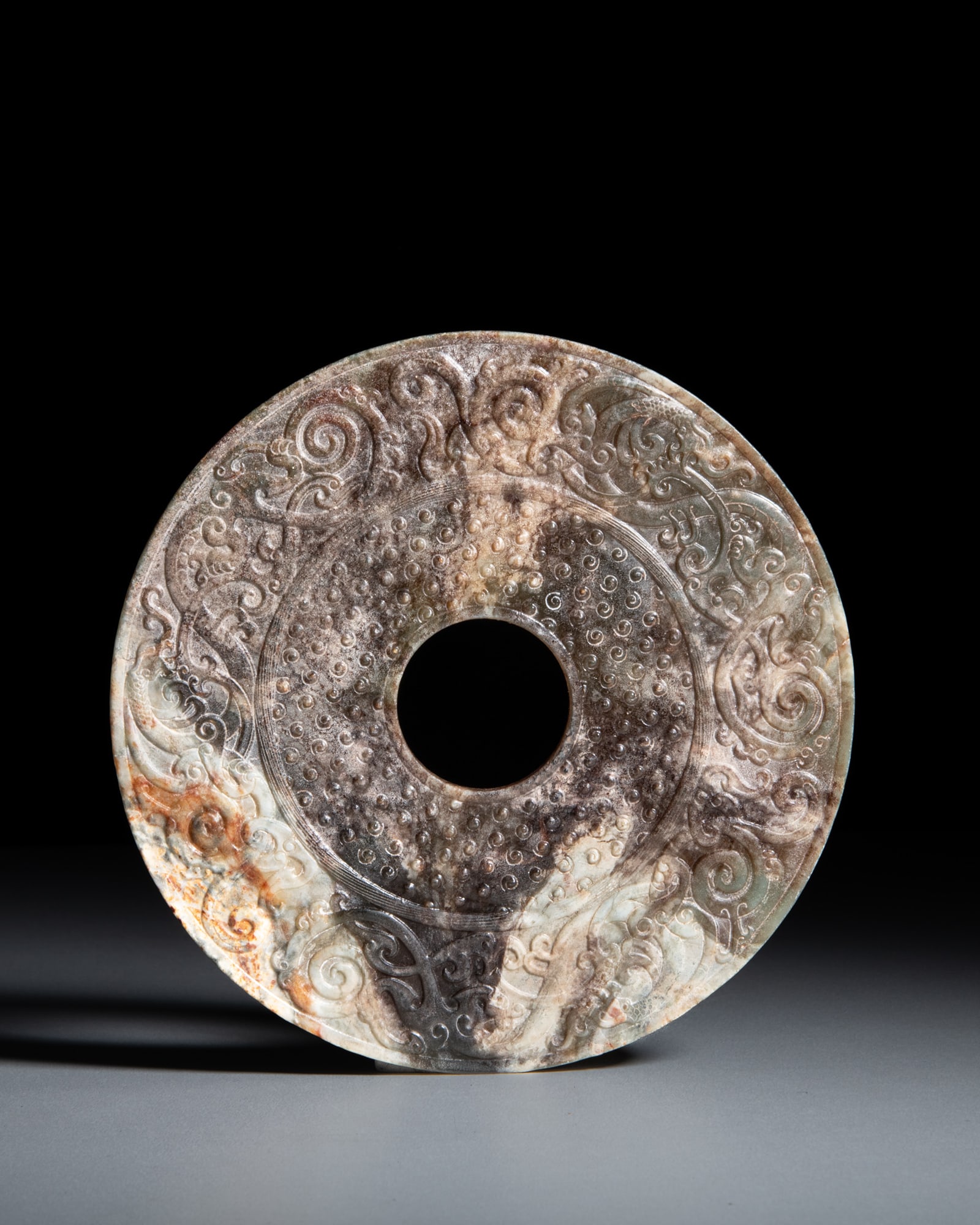 A CARVED 'DRAGONS AND BOSSES' JADE DISC 仿战汉风格 螭龙 (1 of 2)