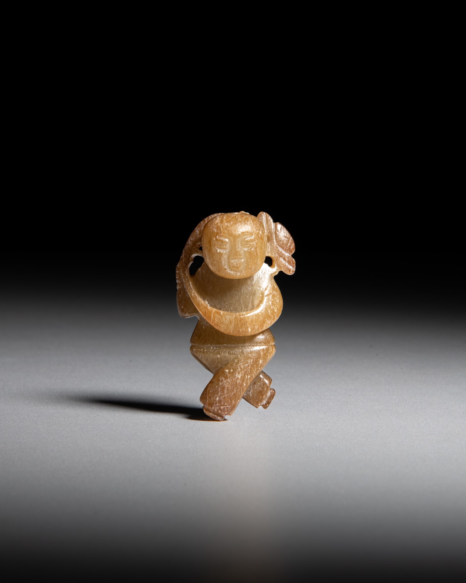 A CELADON JADE CHILD PENDANT 明代 糖色童子玉佩: A CELADON JADE CHILD PENDANT 明代 糖色童子玉佩 China, Ming dynasty H.5.2cm