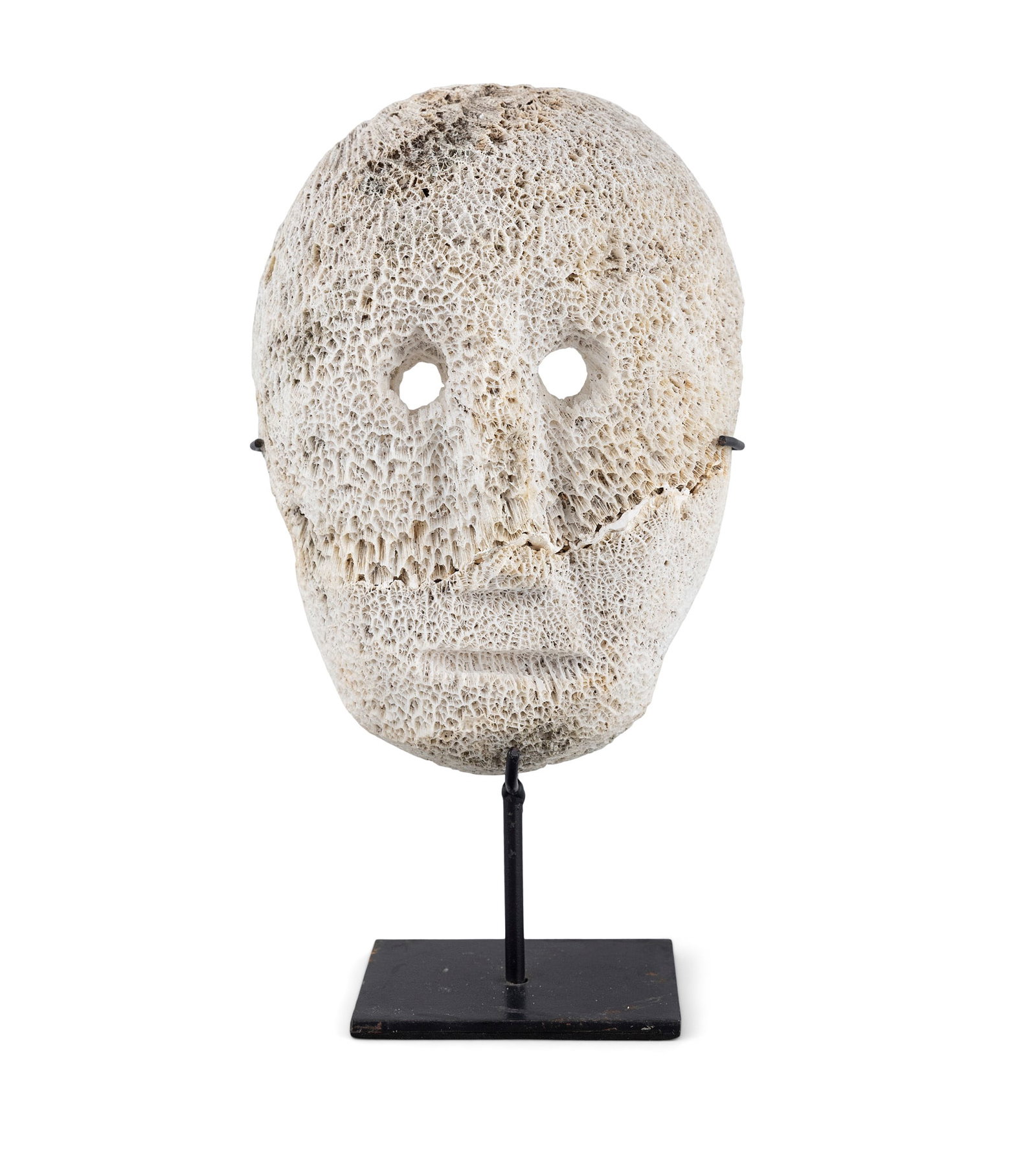 A FOSSILIZED CORAL ATONI ANCESTRAL MASK East Timor H.25.5cm with a metal stand Note (1 of 4)