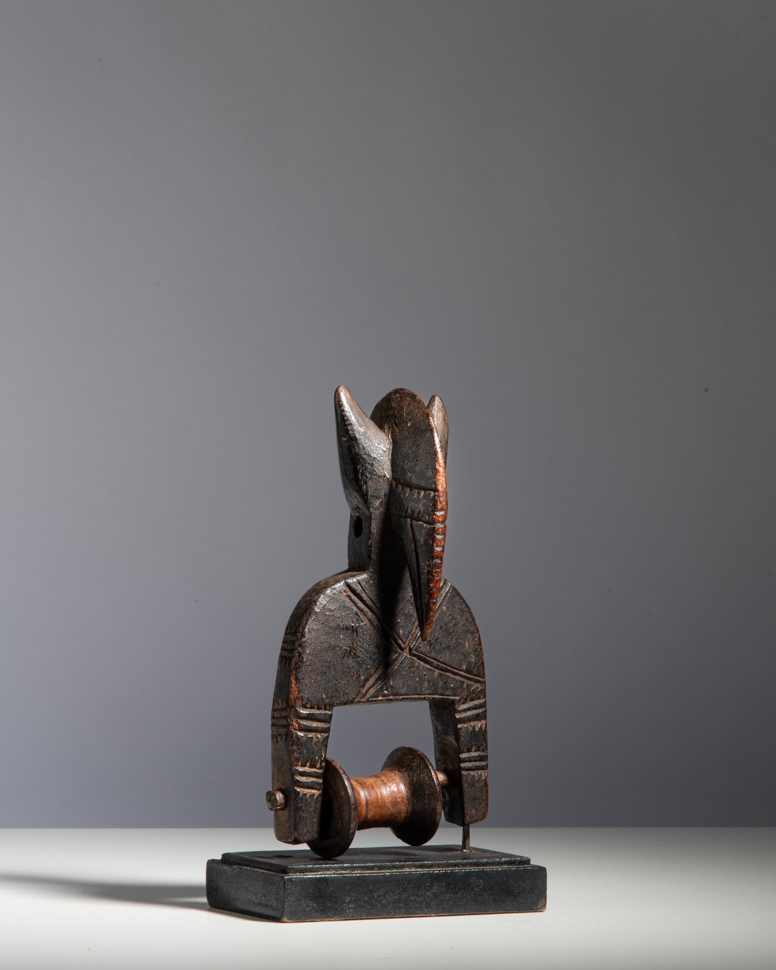 A BAULE LOOM PULLEY Ivory Coast Wood This finely carved heddle pulley features an elegant head (1 of 3)